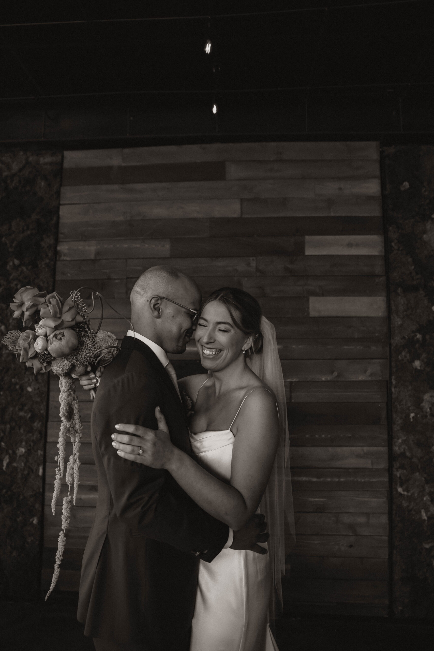 candid of bride and groom smiling at one of the most perfect Denver Colorado venues