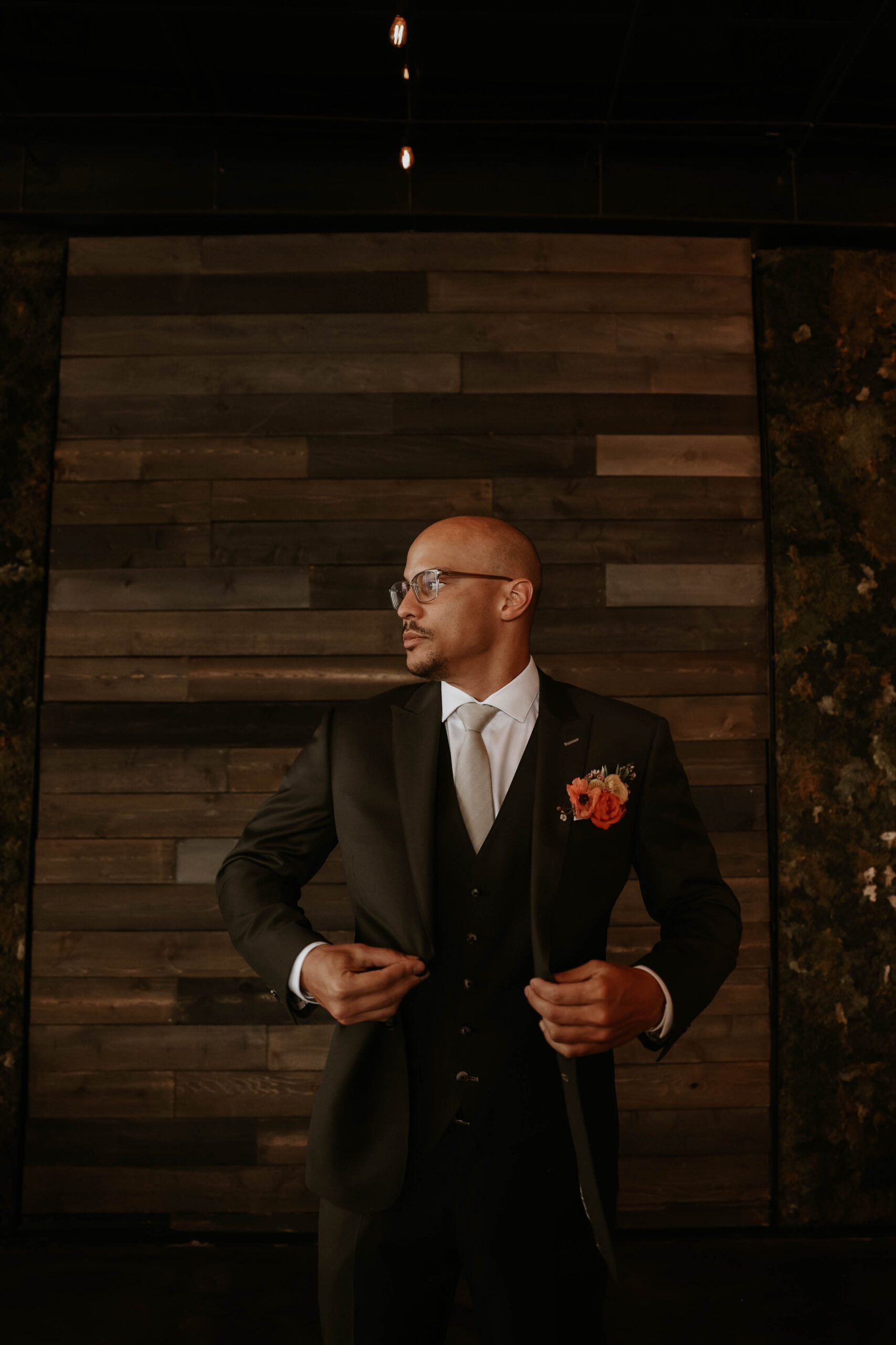 groom buttoning his jacket at one of the most perfect Denver Colorado venues