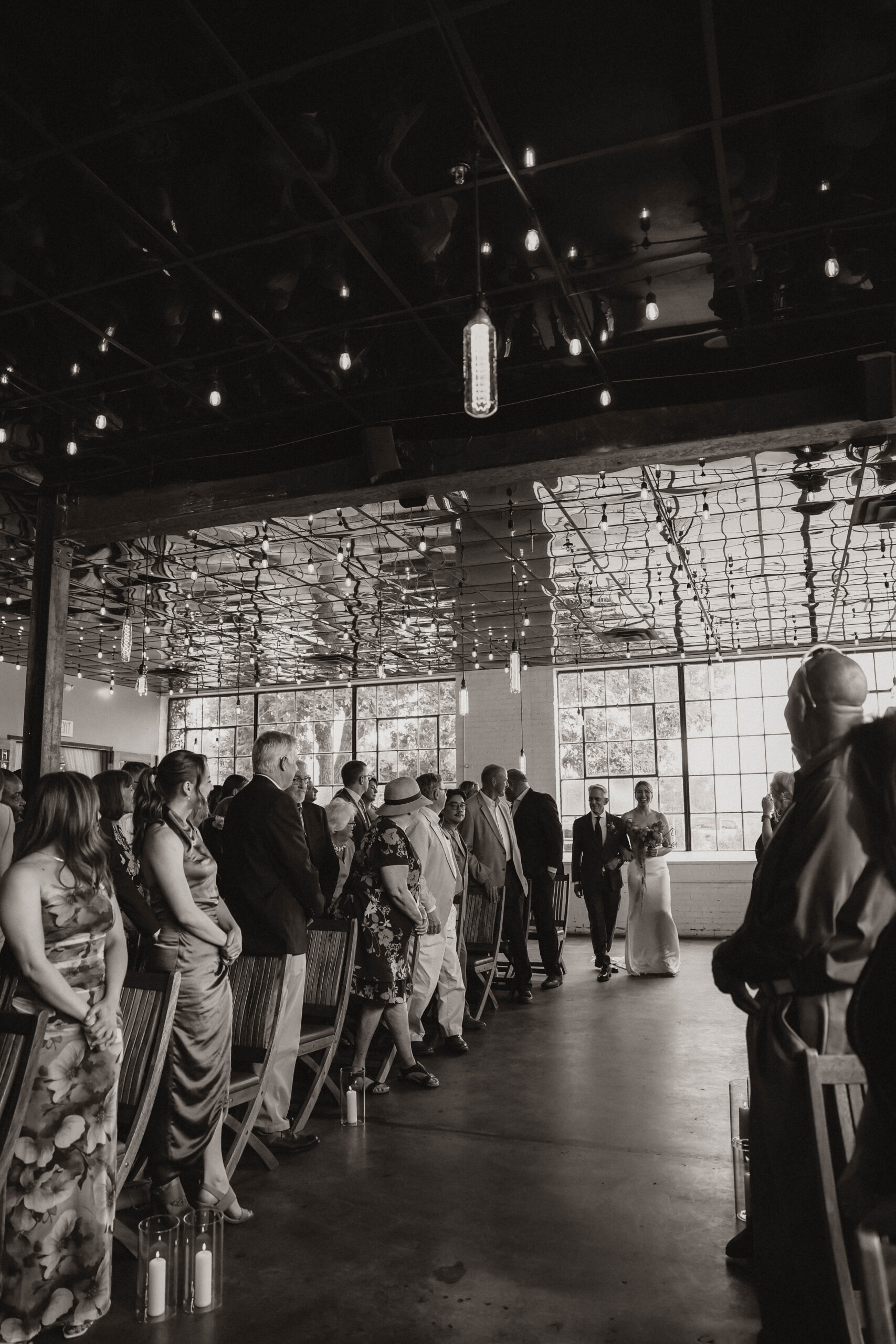 bride and her father coming down the aisle at one of the most perfect Denver Colorado venues