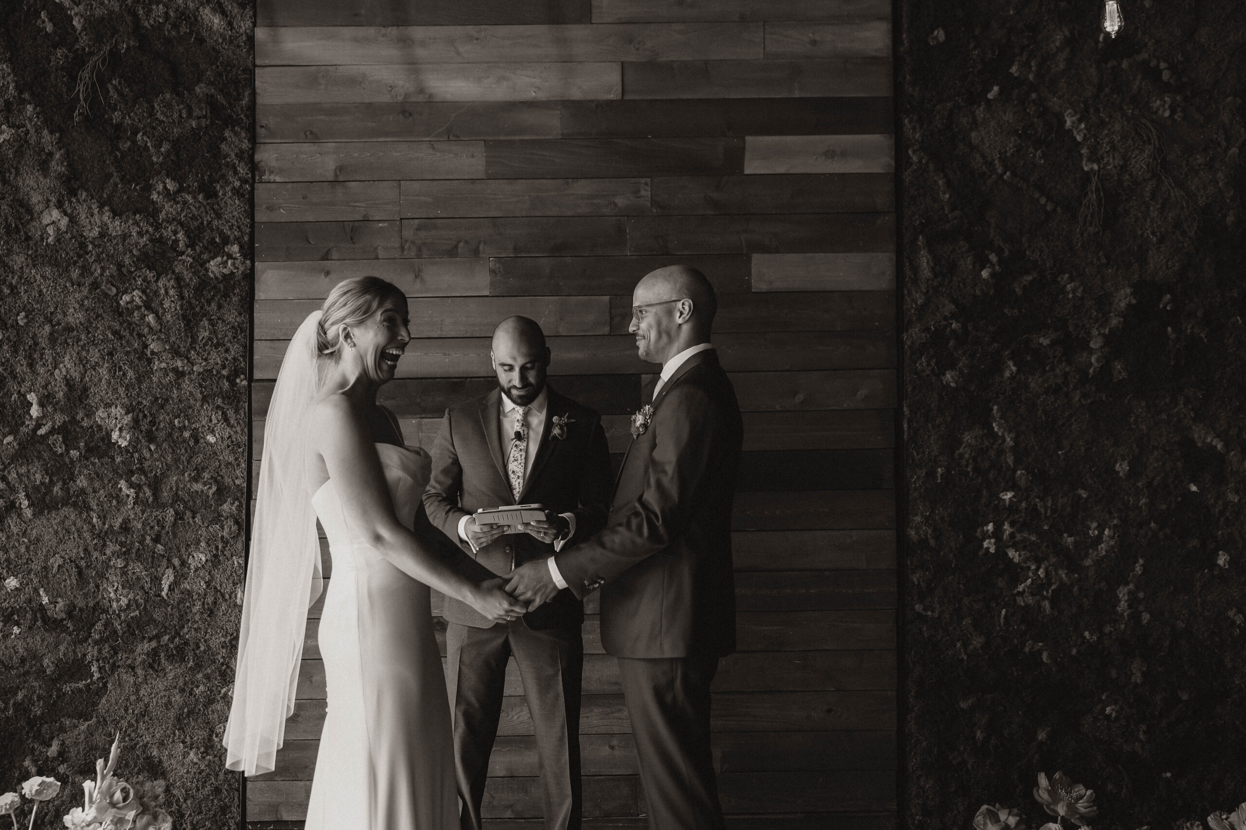 bride laughing at the altar with soon to be husband at one of the most perfect Denver Colorado venues