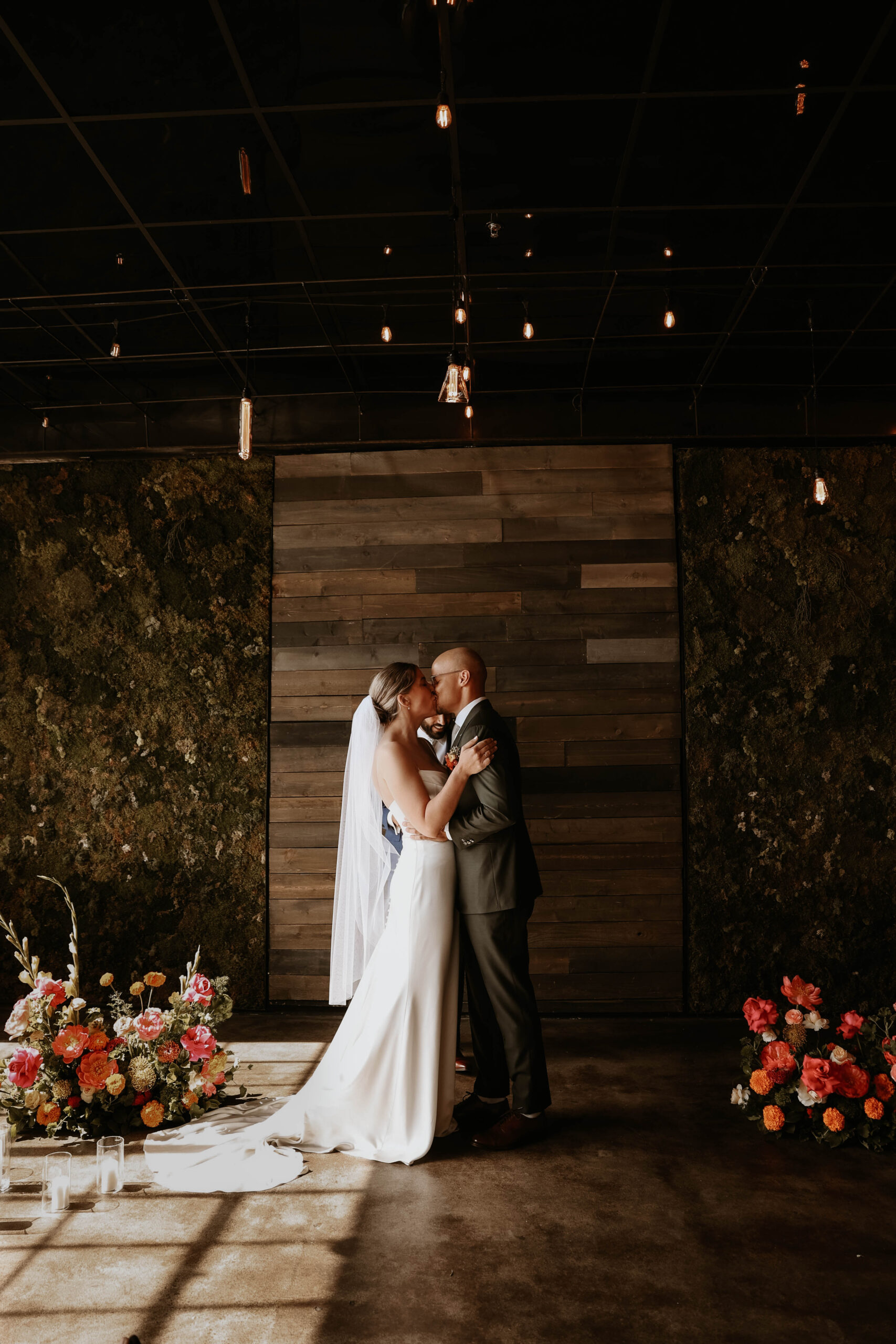 bride and groom kissing at the altar at one of the most perfect Denver Colorado venues