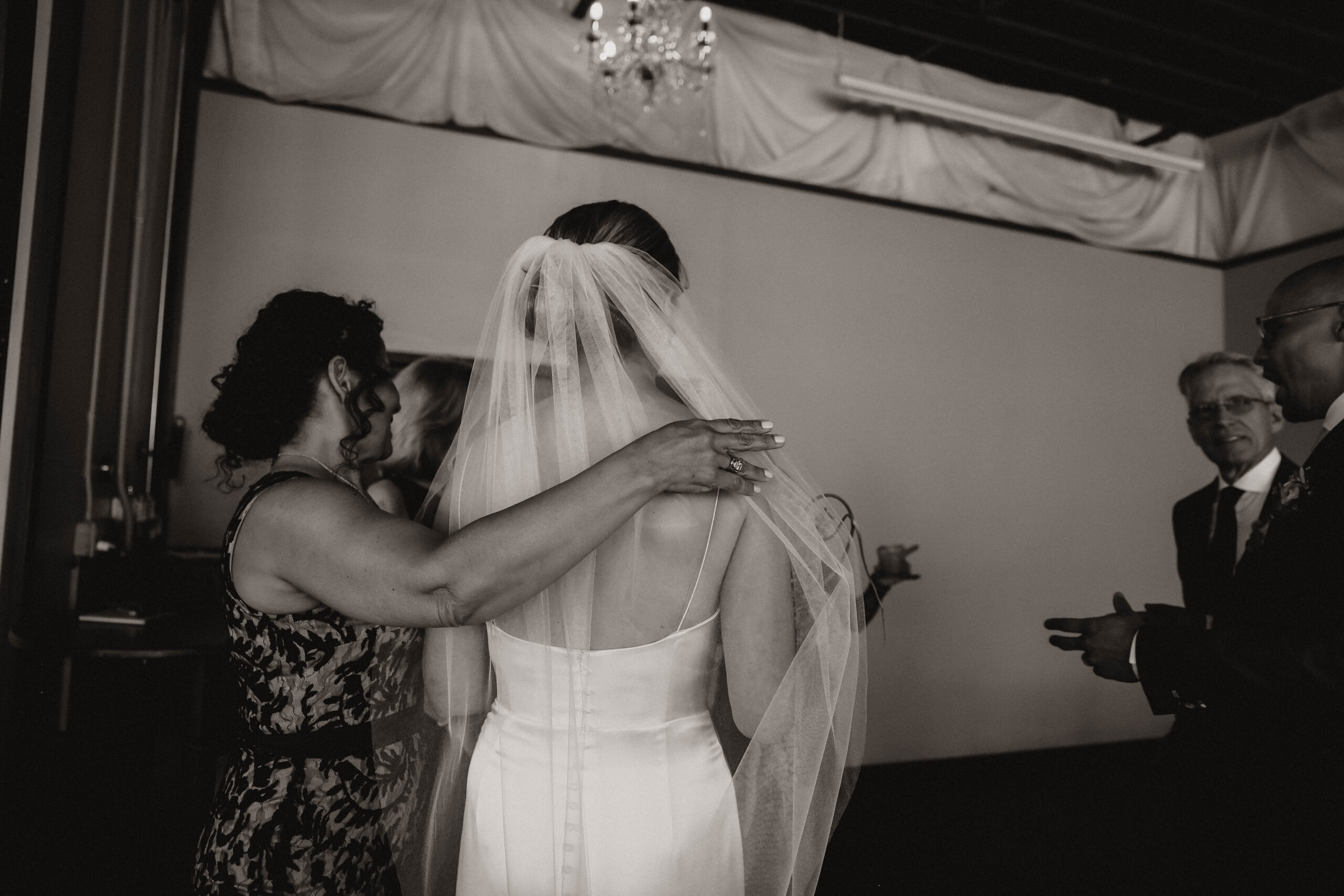 candid of bride and wedding guests 