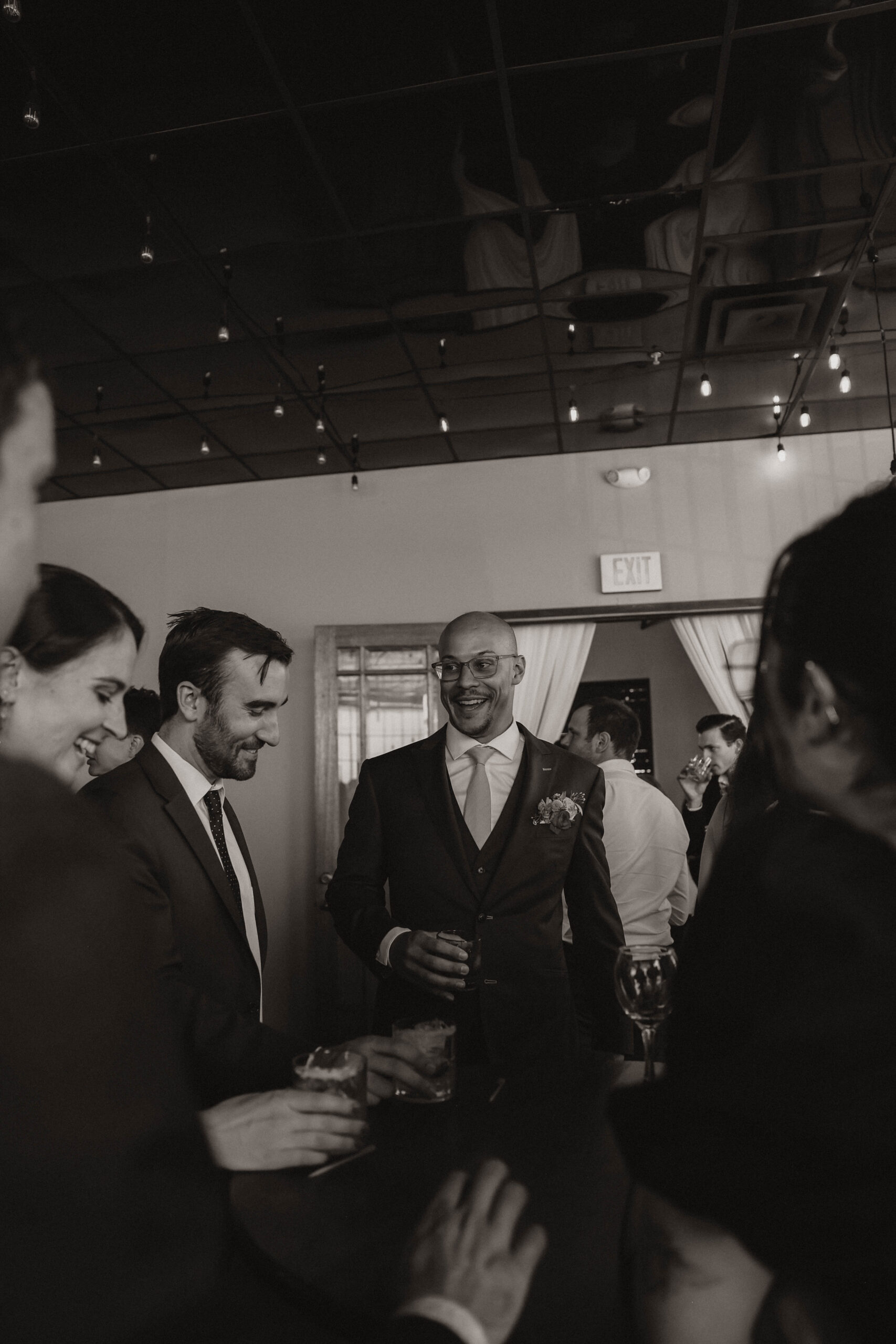 groom talking with guests at cocktail hour at one of the most perfect Denver Colorado venues