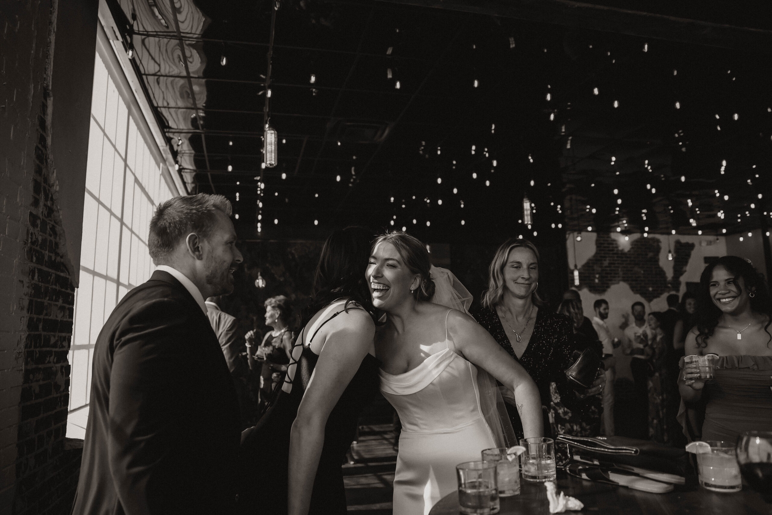 bride mingling with guests at cocktail hour at one of the most perfect Denver Colorado venues