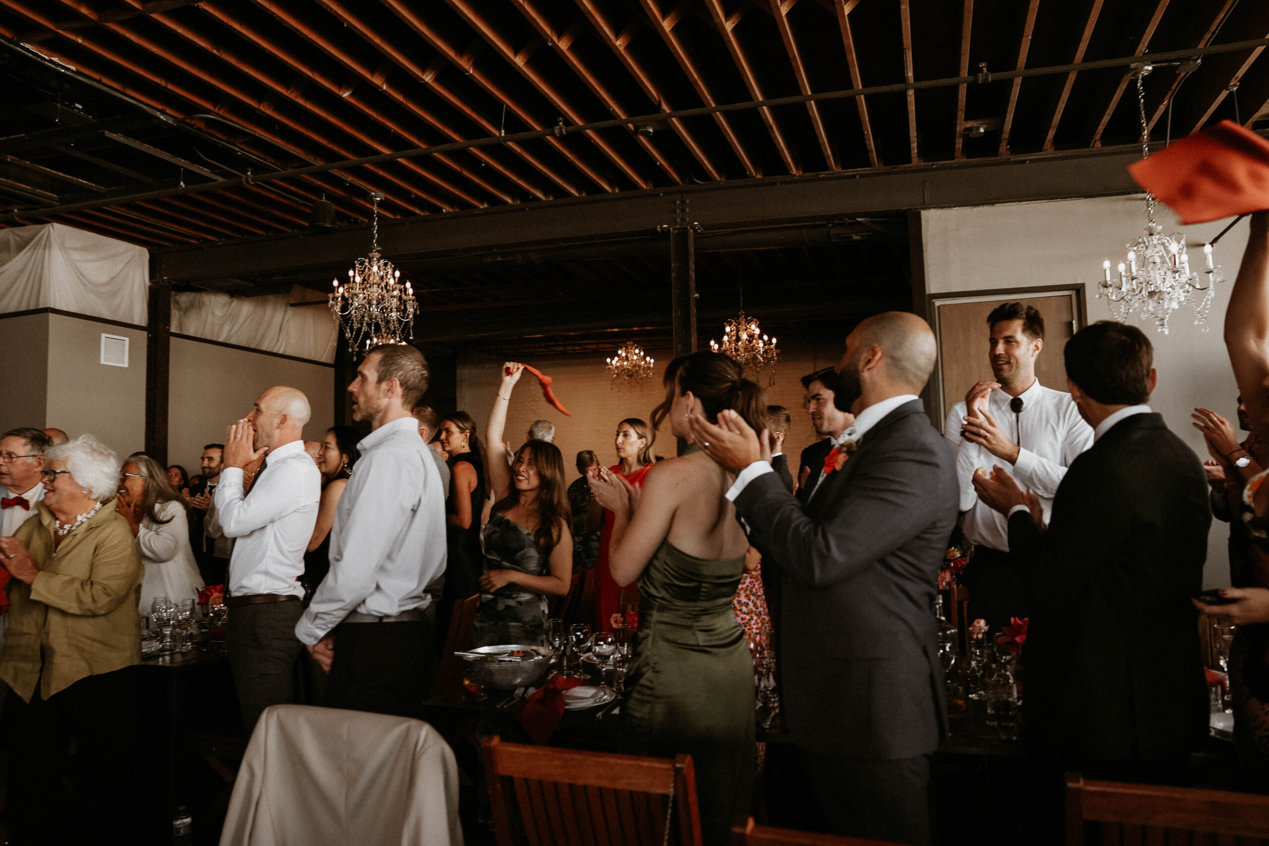 guests clapping as bridal couple walks in 