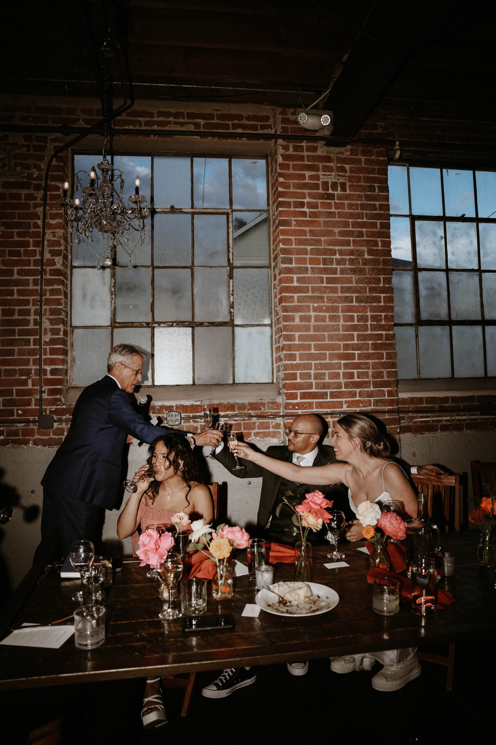 wedding couple toasting bride's father 