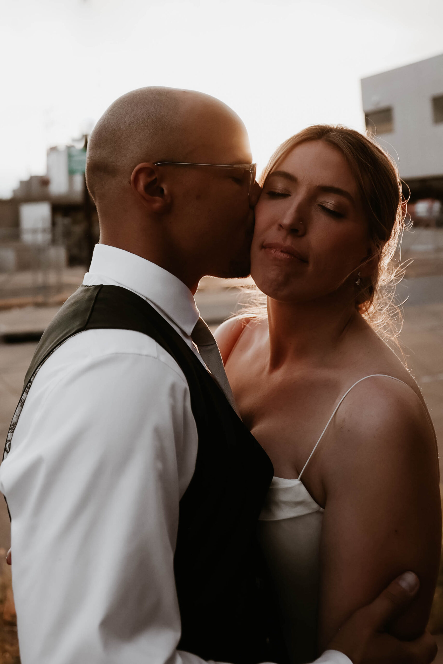 bride and groom outdoor portrait at sunset 