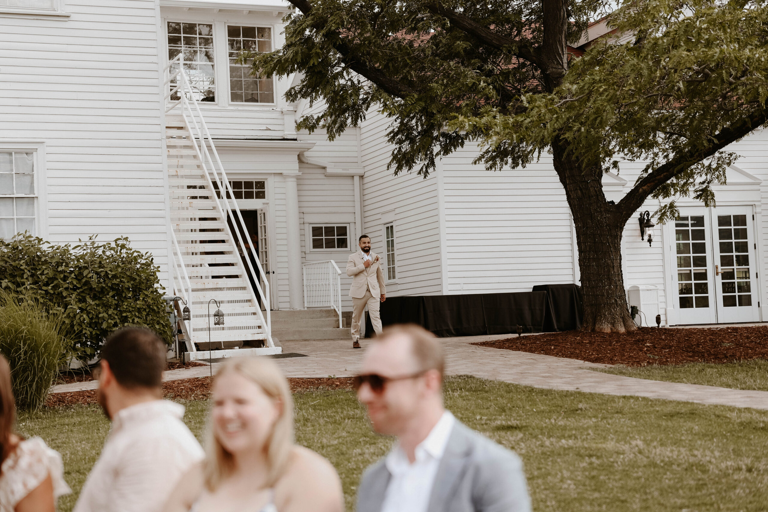 groom walking out to the manor house wedding ceremony 