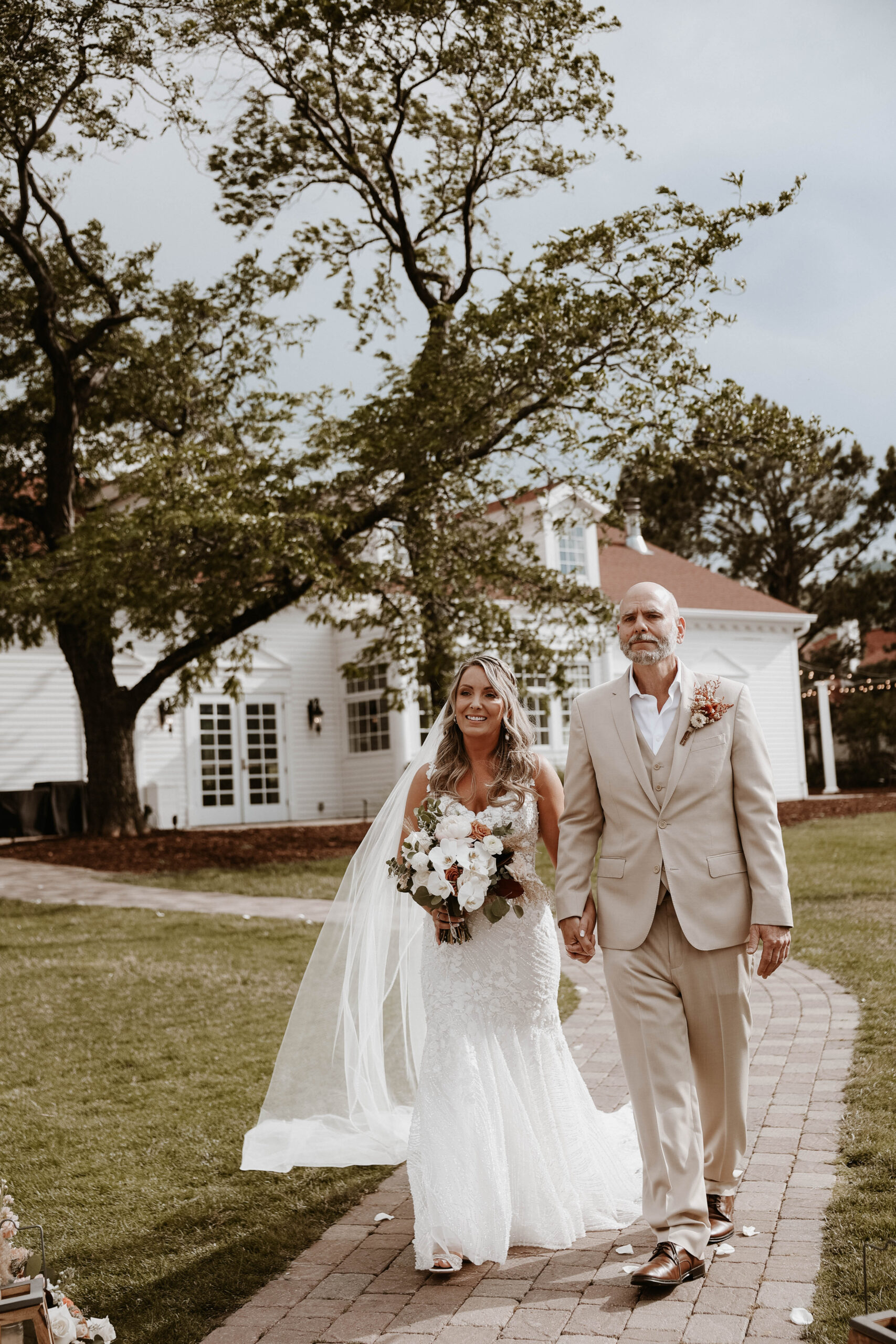 bride and her father walking down the aisle 