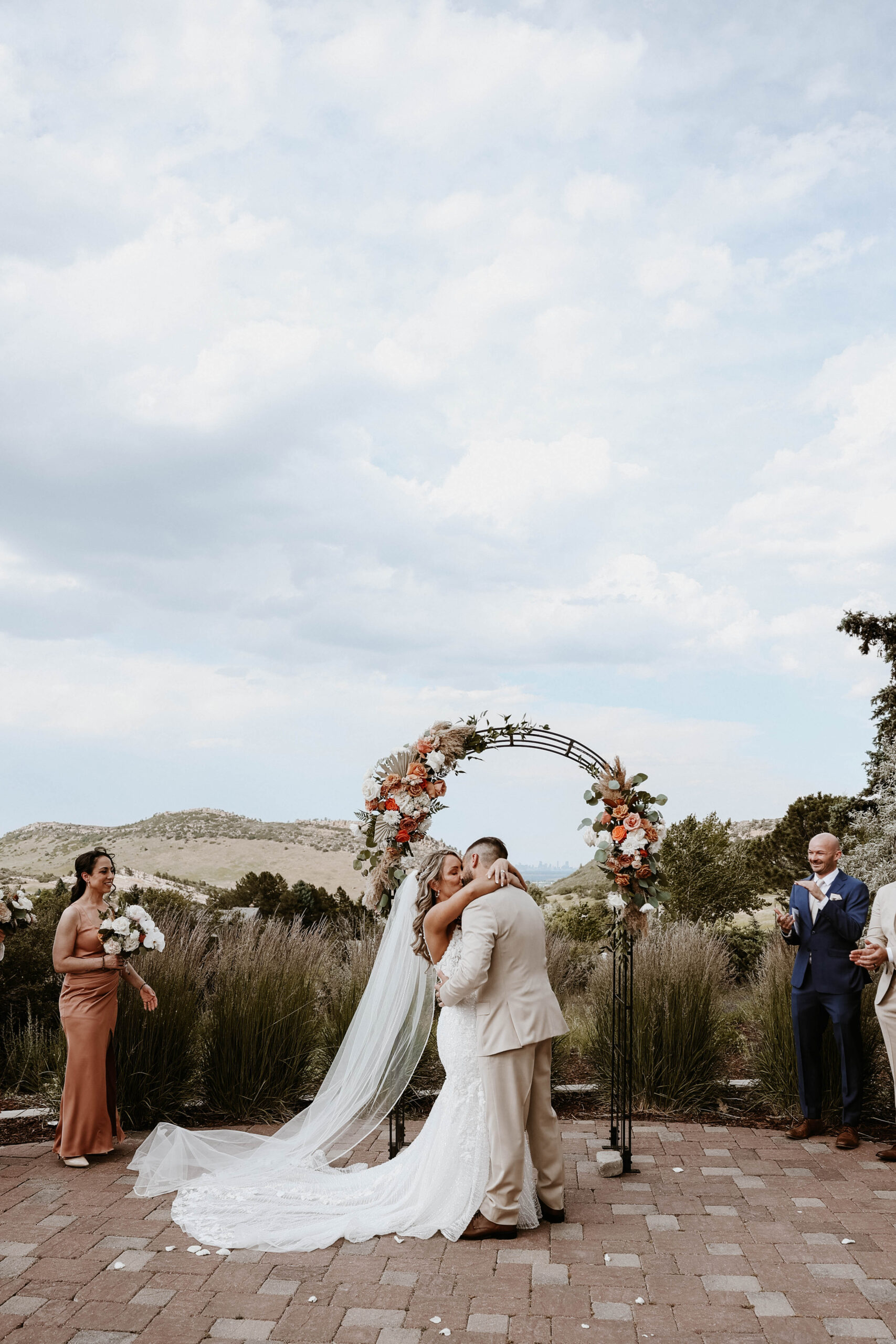 bride and groom kissing at the altar 