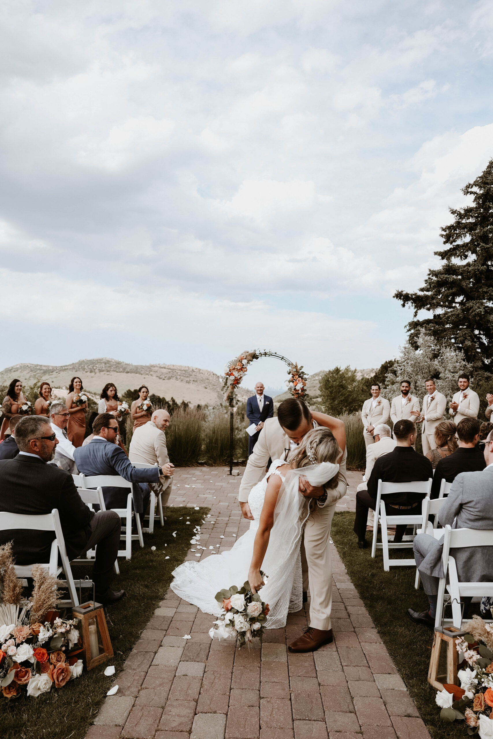 bride and groom kissing after ceremony 