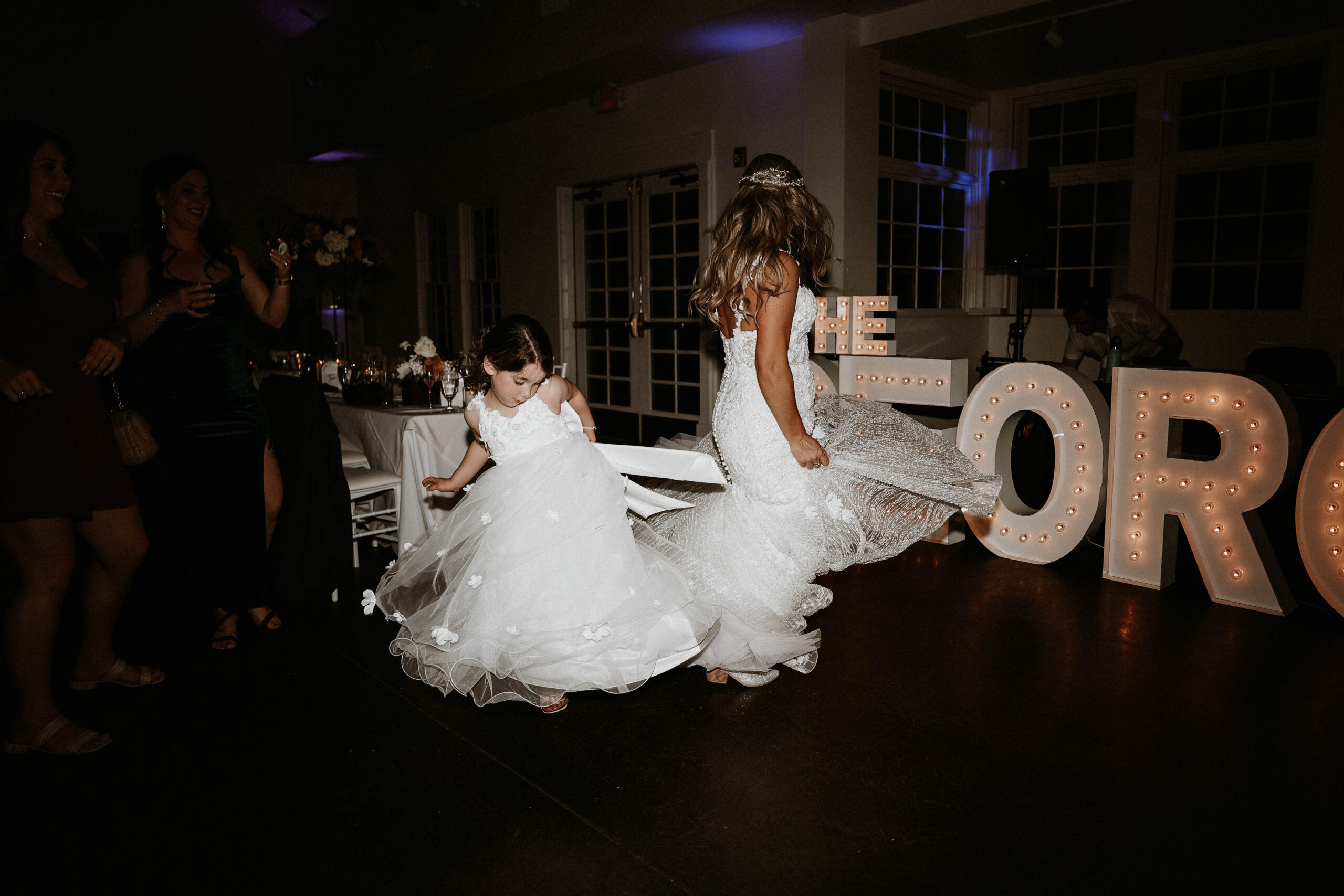 bride and flower girl dancing 