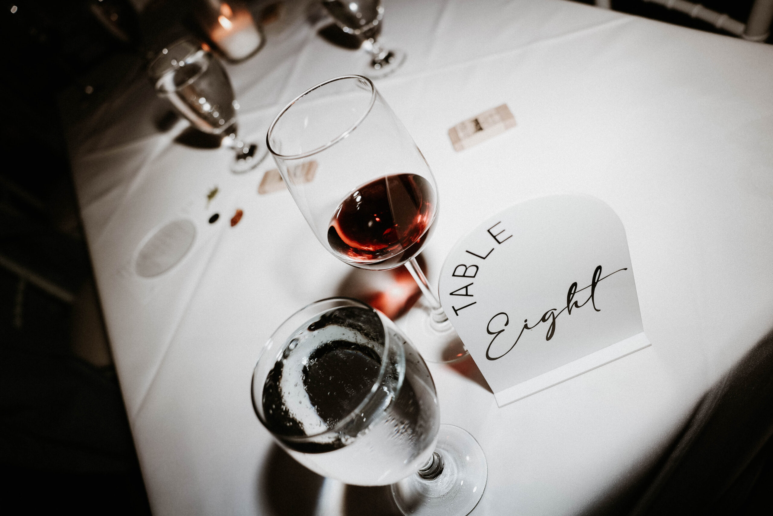 manor house wedding reception table with wine on it 