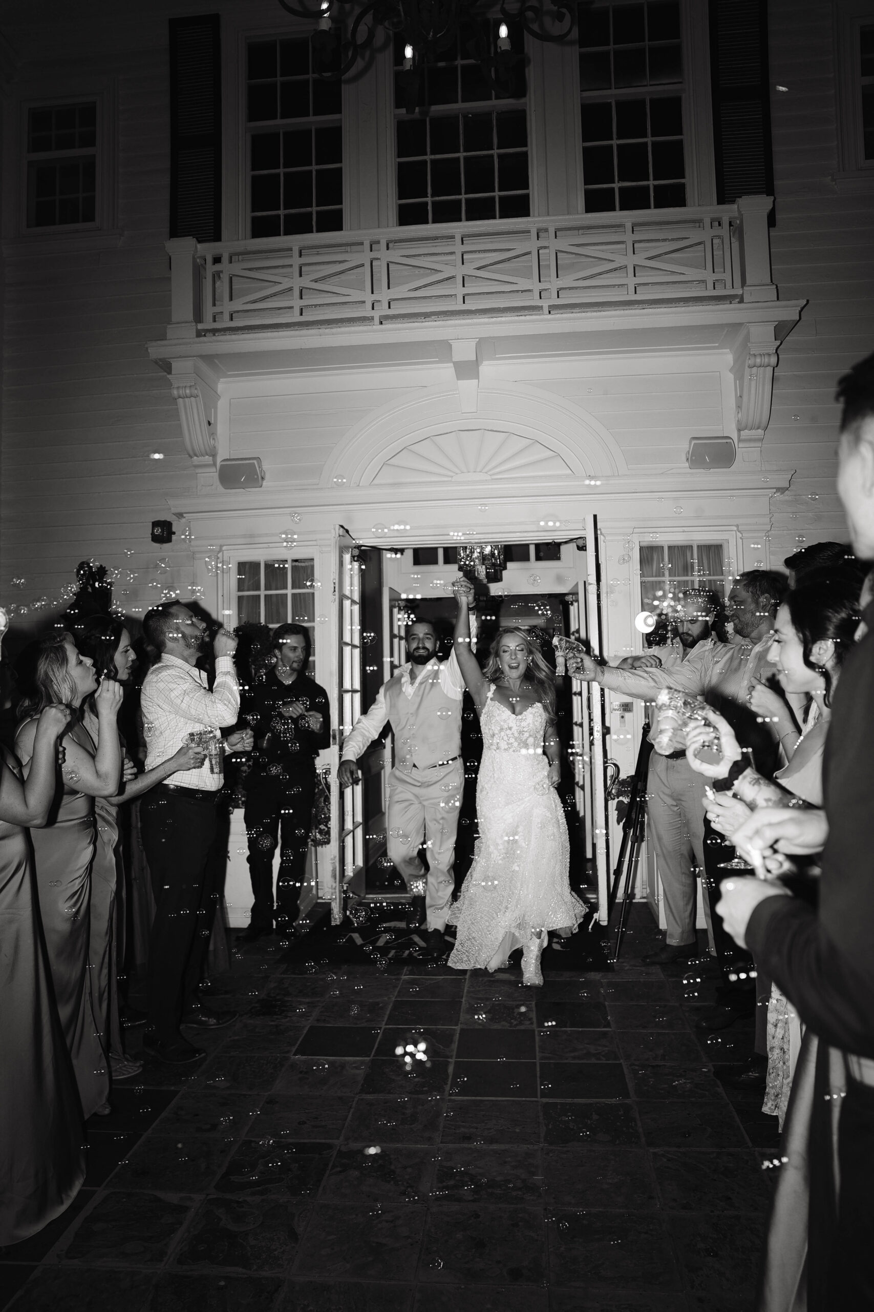 manor house wedding couple during a bubble exit 