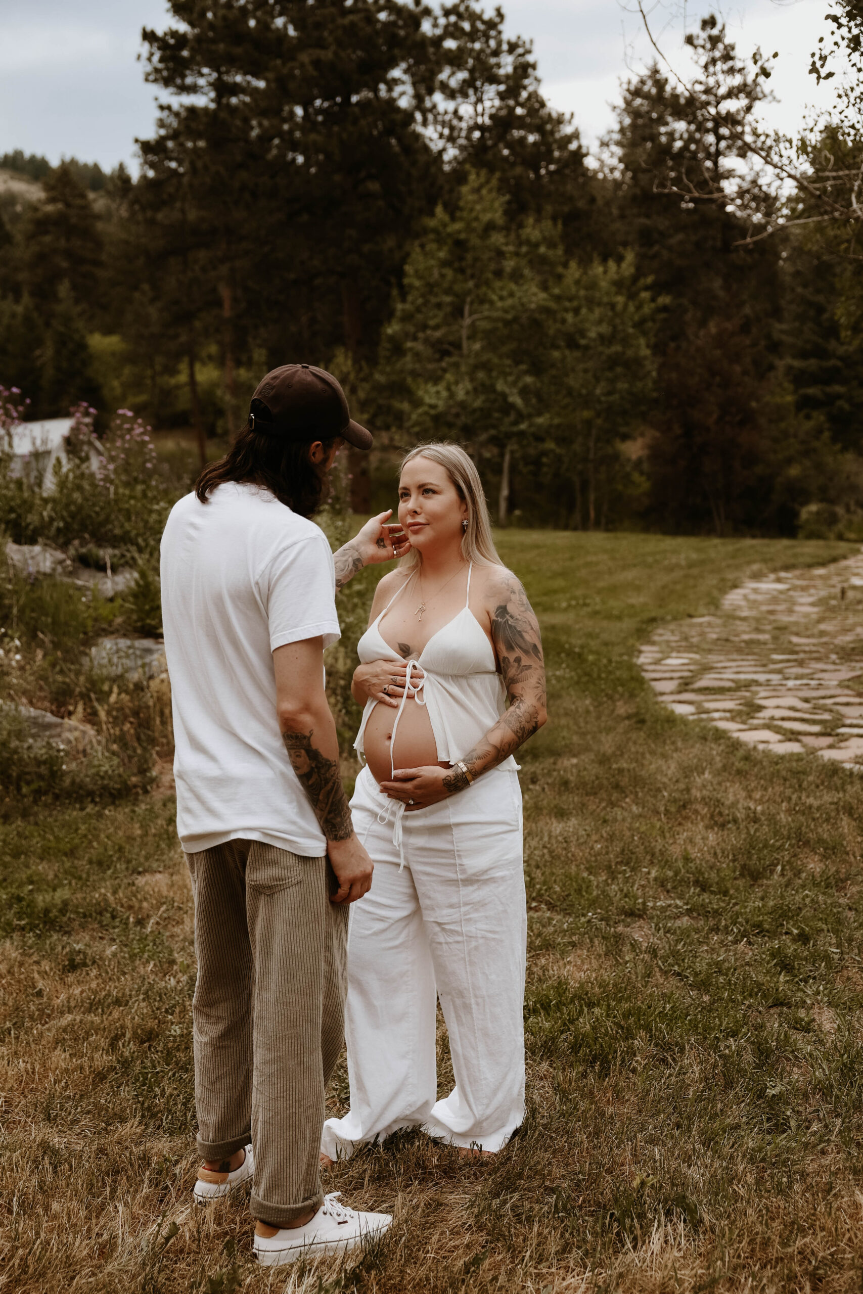 a couple looking at each other during their Denver Maternity Photography session 