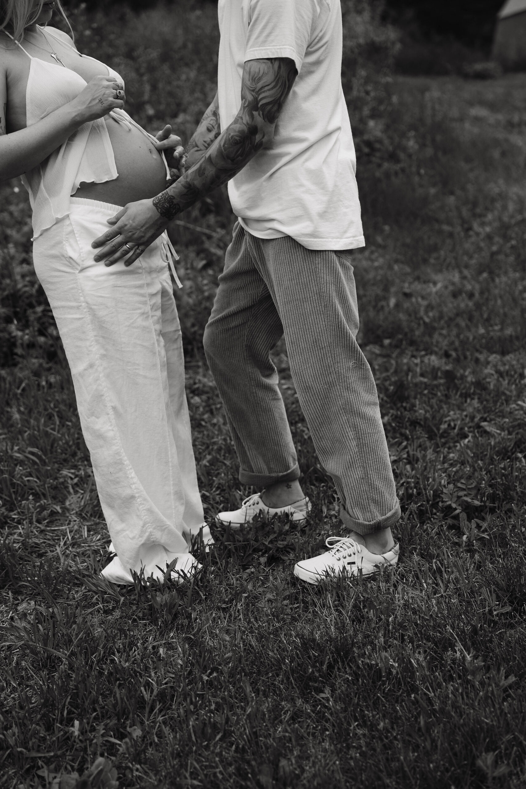 a couple holding each other during their maternity session