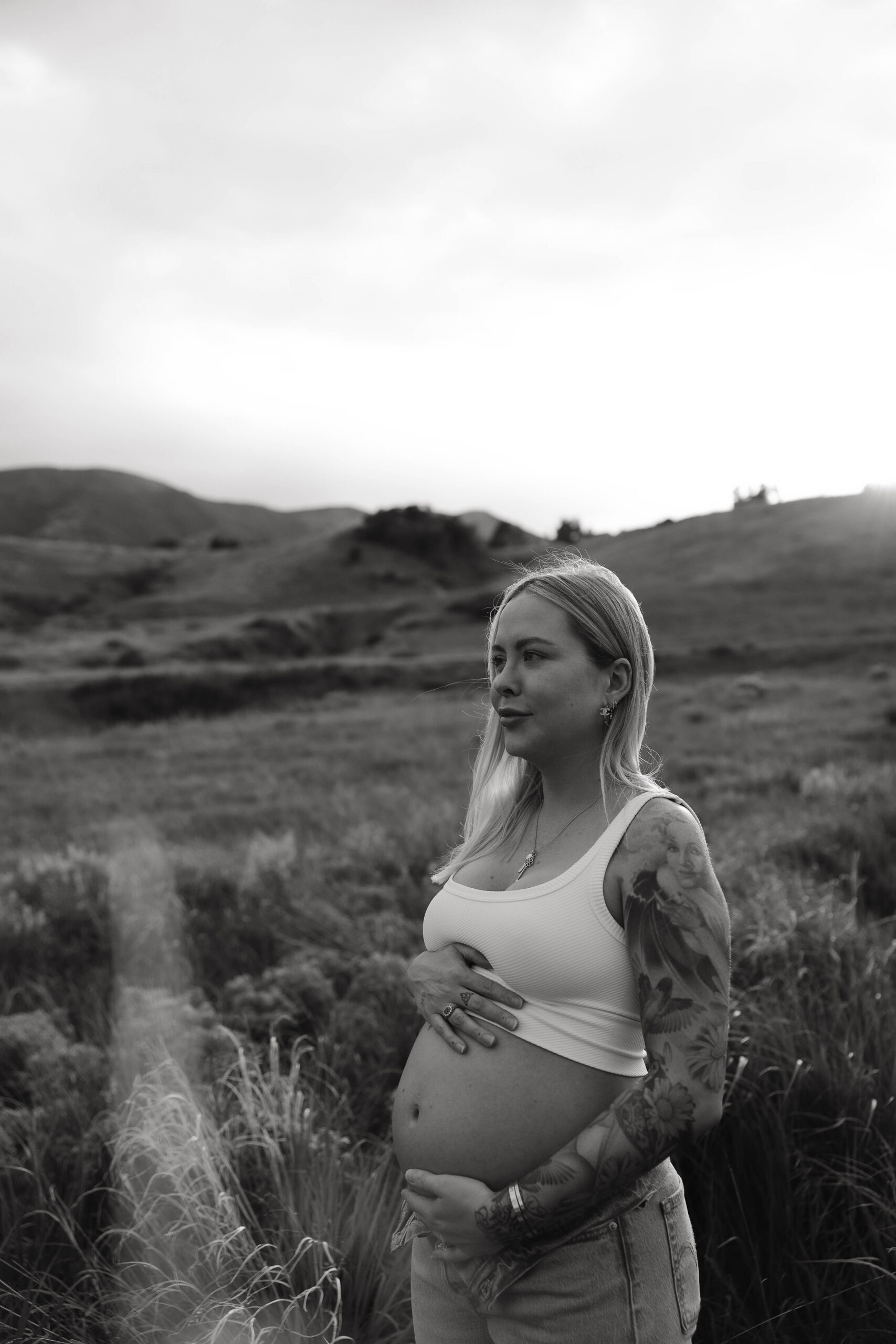 a pregnant woman during a jeans maternity session in Colorado 