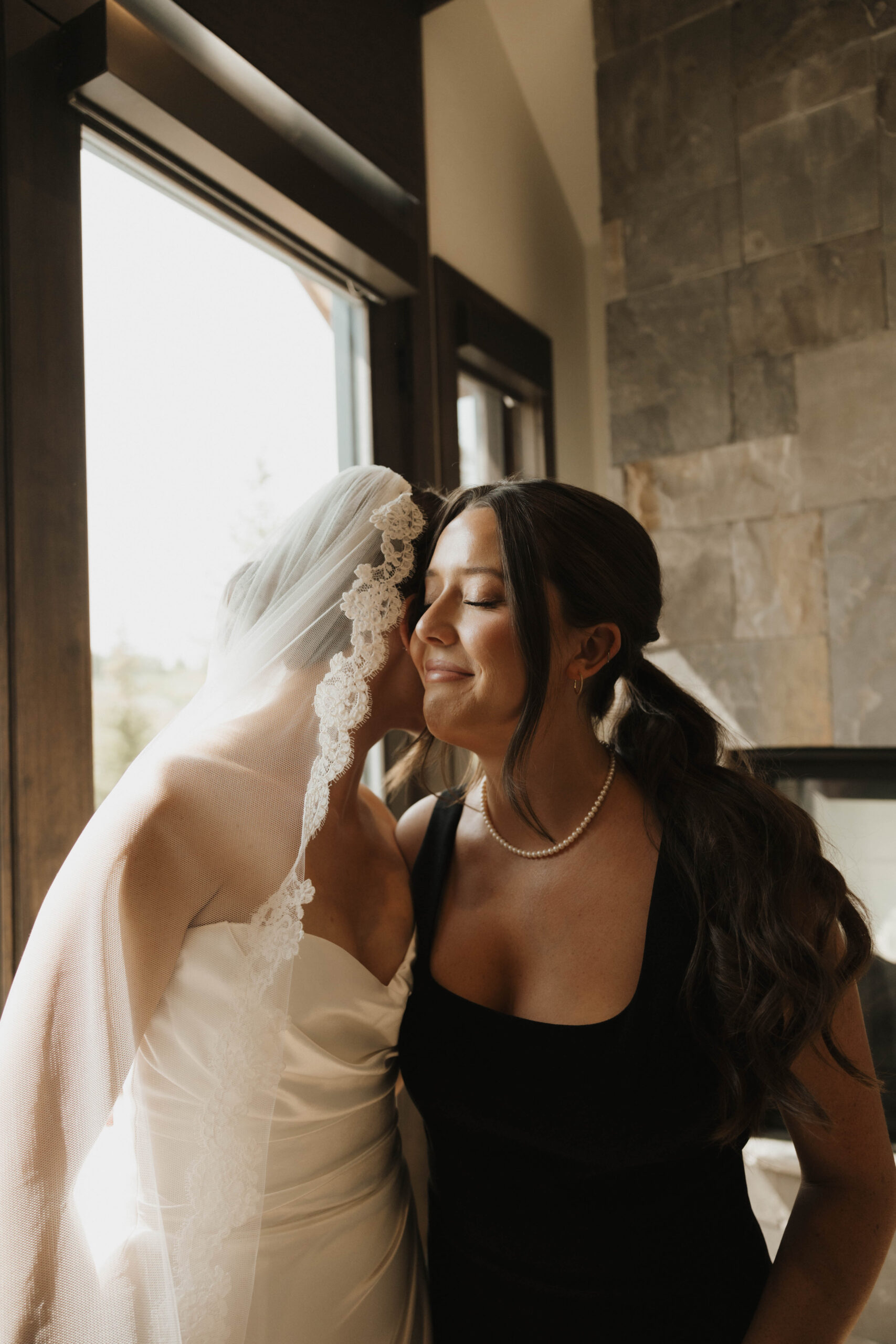 bride and her loved one sharing an intimate moment at her Colorado micro wedding