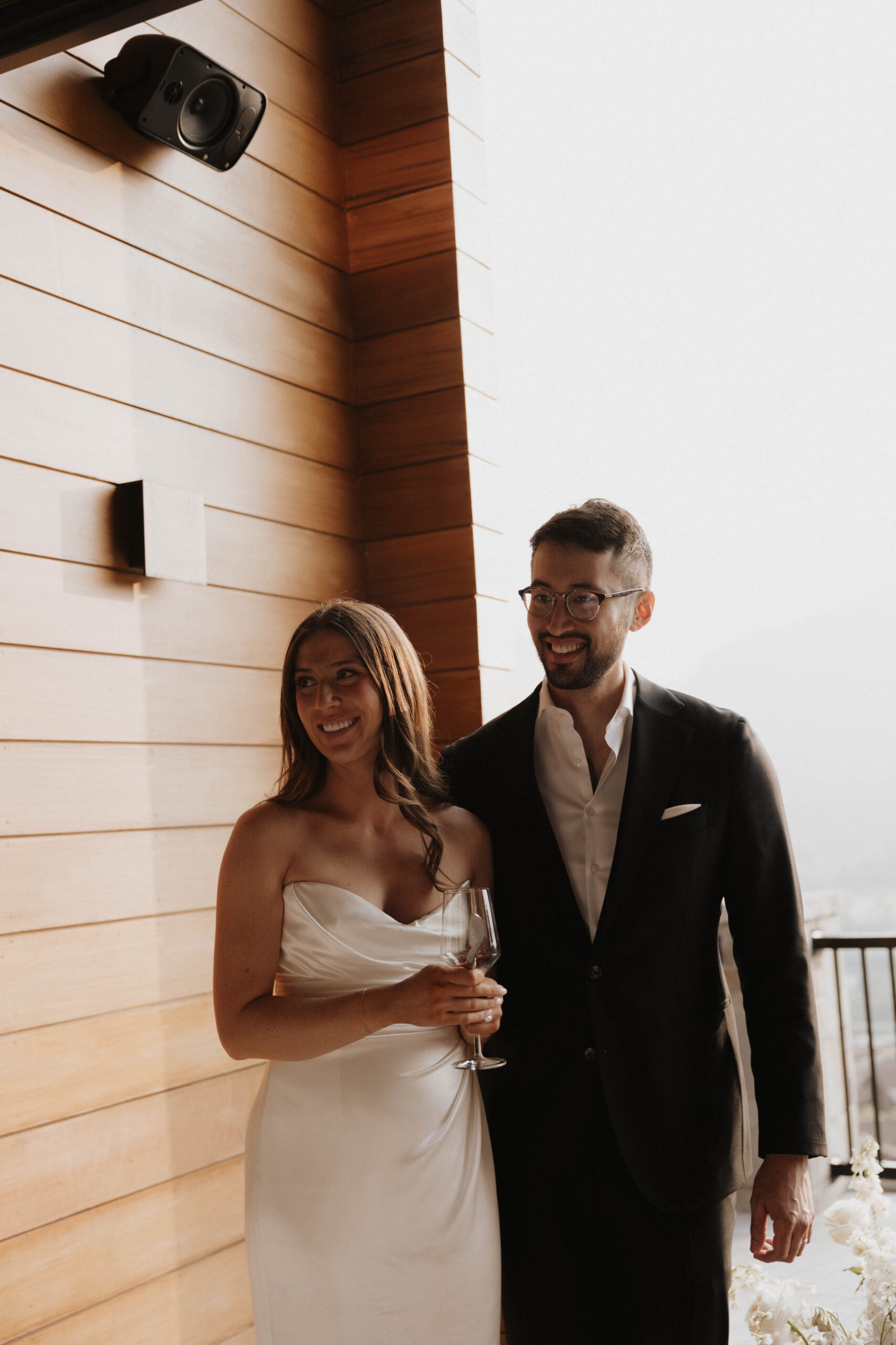 bride and groom smiling at their guests at their Colorado micro wedding