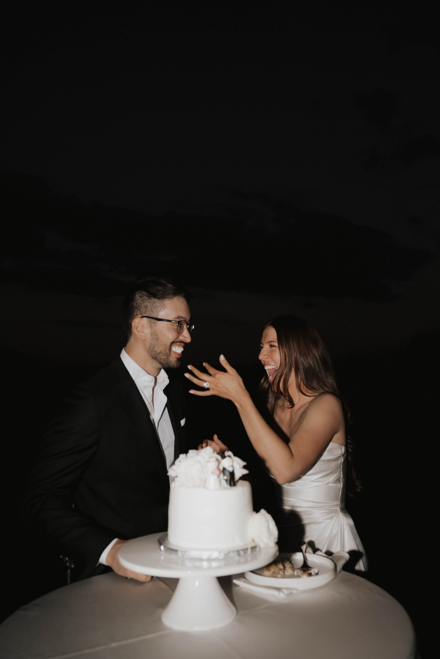 bride feeding groom wedding cake 