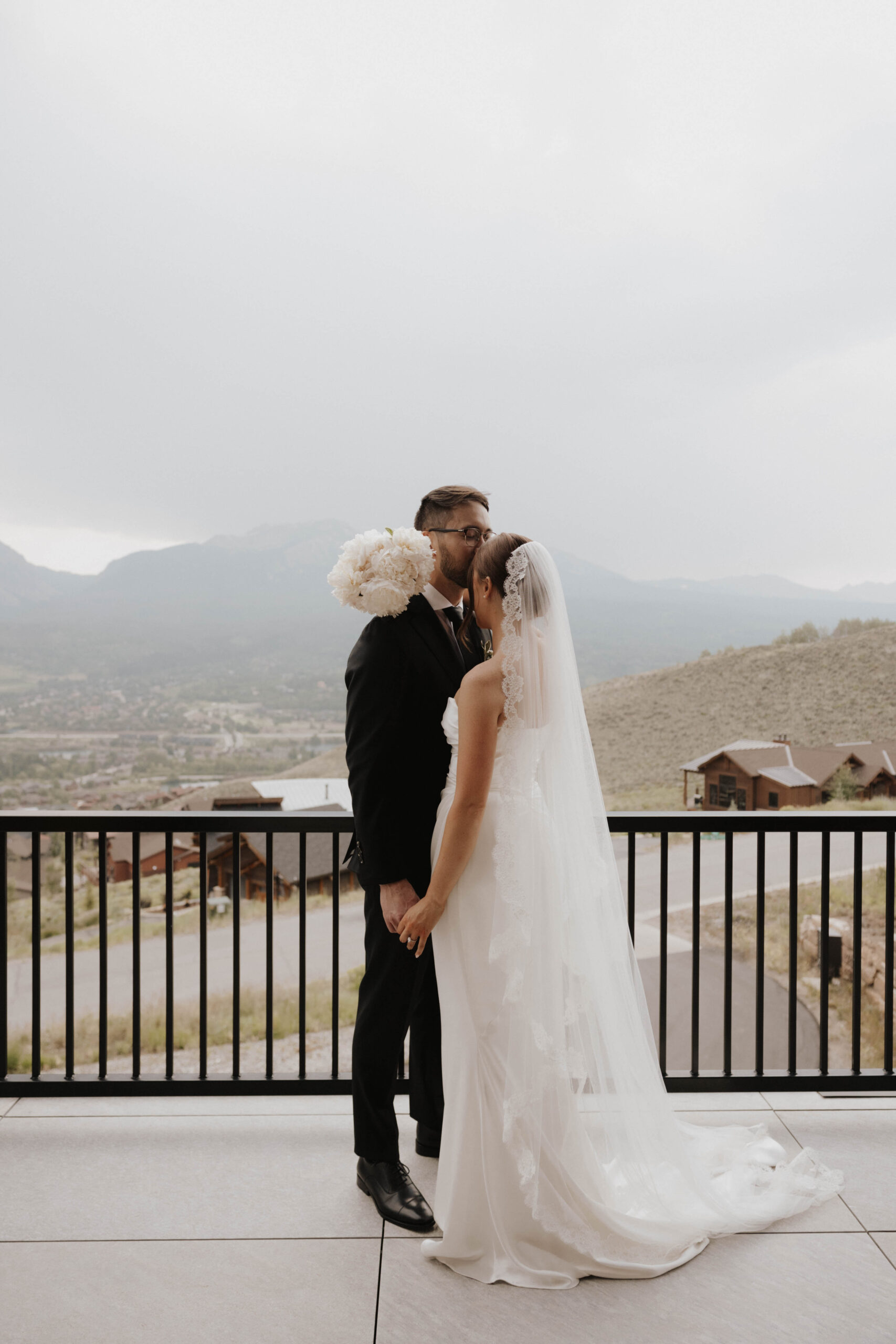 bride and groom portrait on the airbnb balcony 