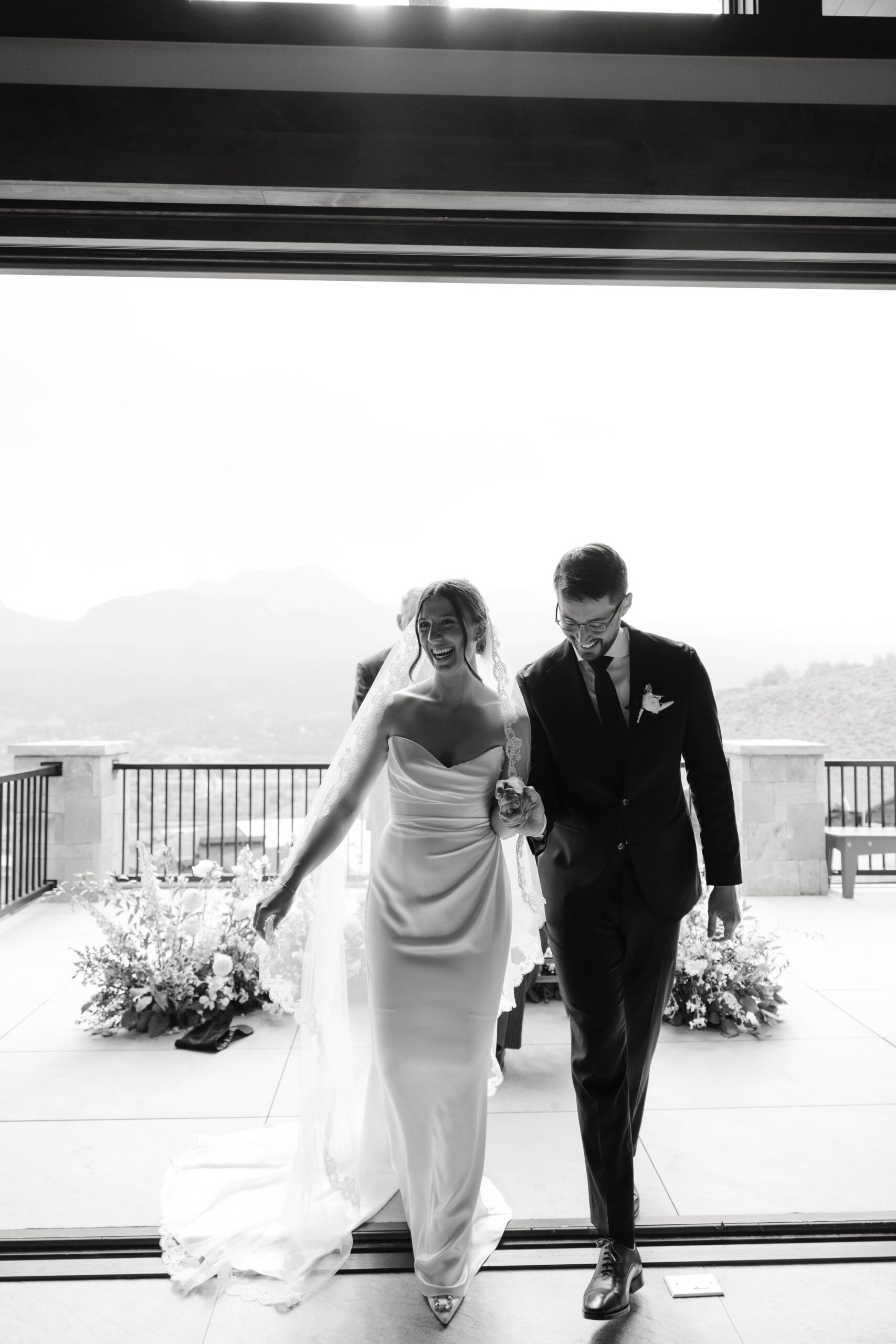 candid moment of bride and groom walking down the aisle 