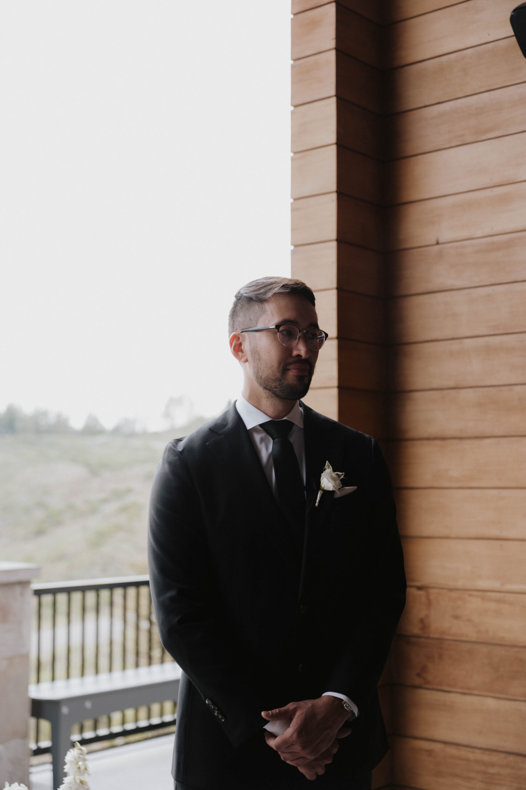 groom standing at the Colorado micro wedding altar