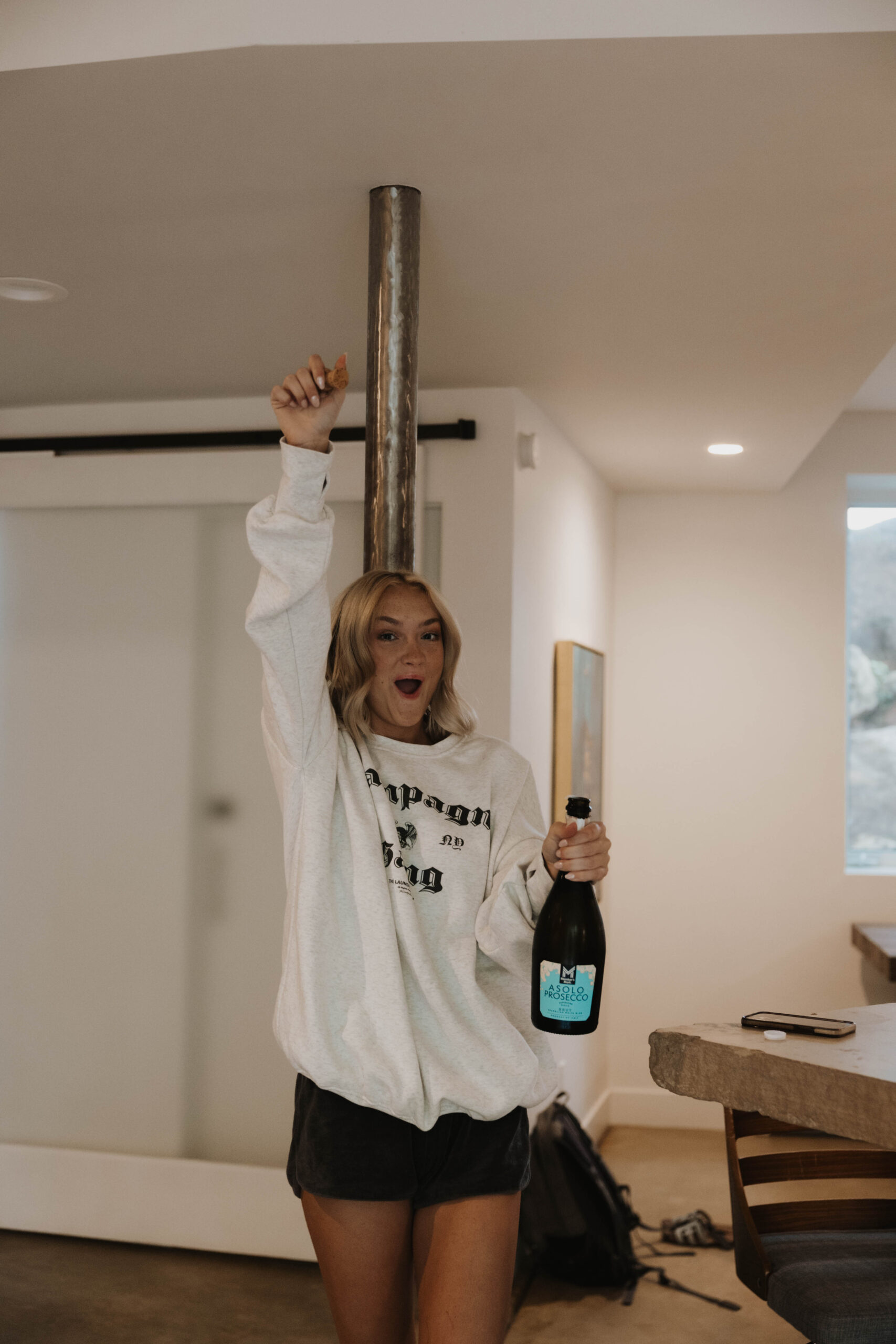 bridesmaid walking with champagne