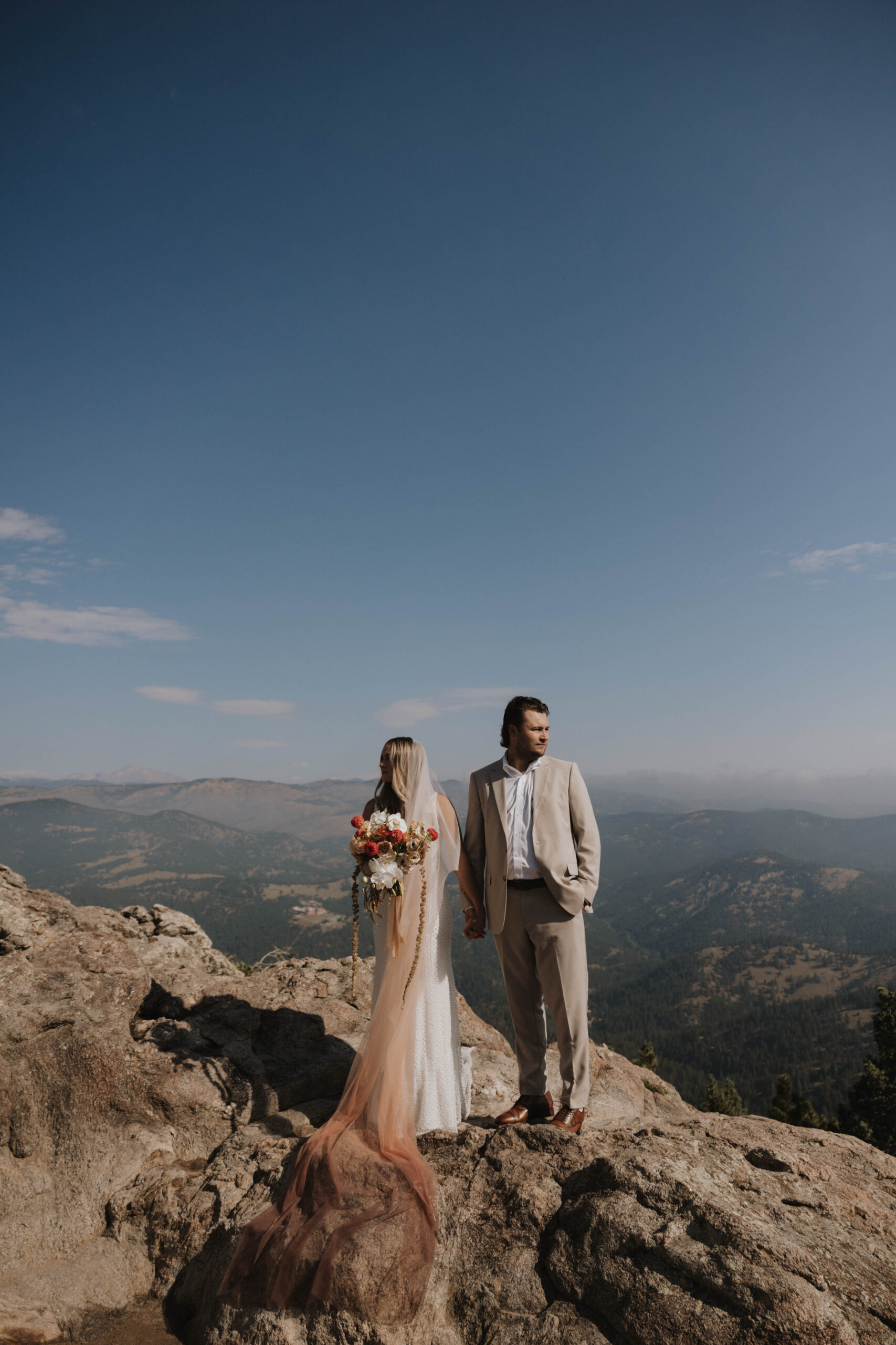 bride and groom portrait on a mountain 