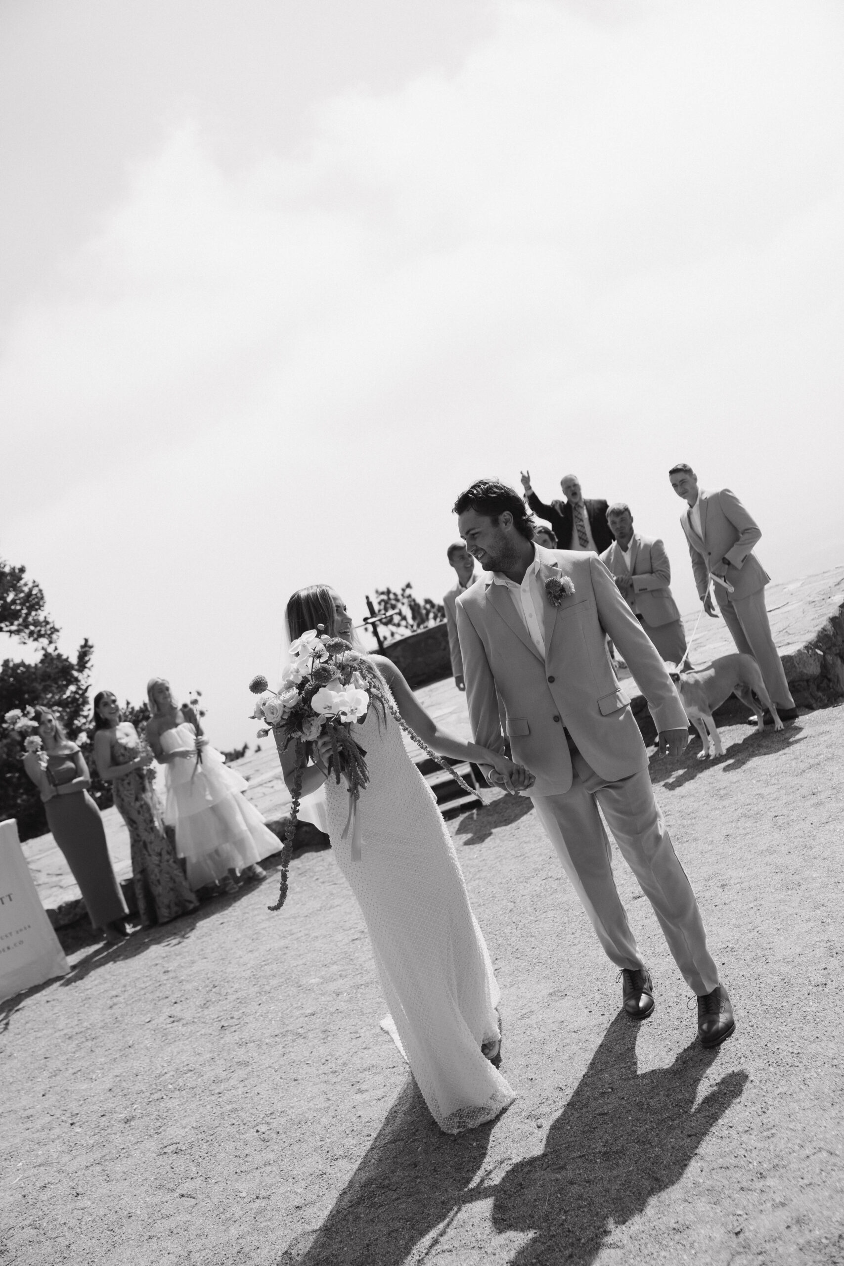 bride and groom walking away from the Boulder Colorado wedding ceremony 