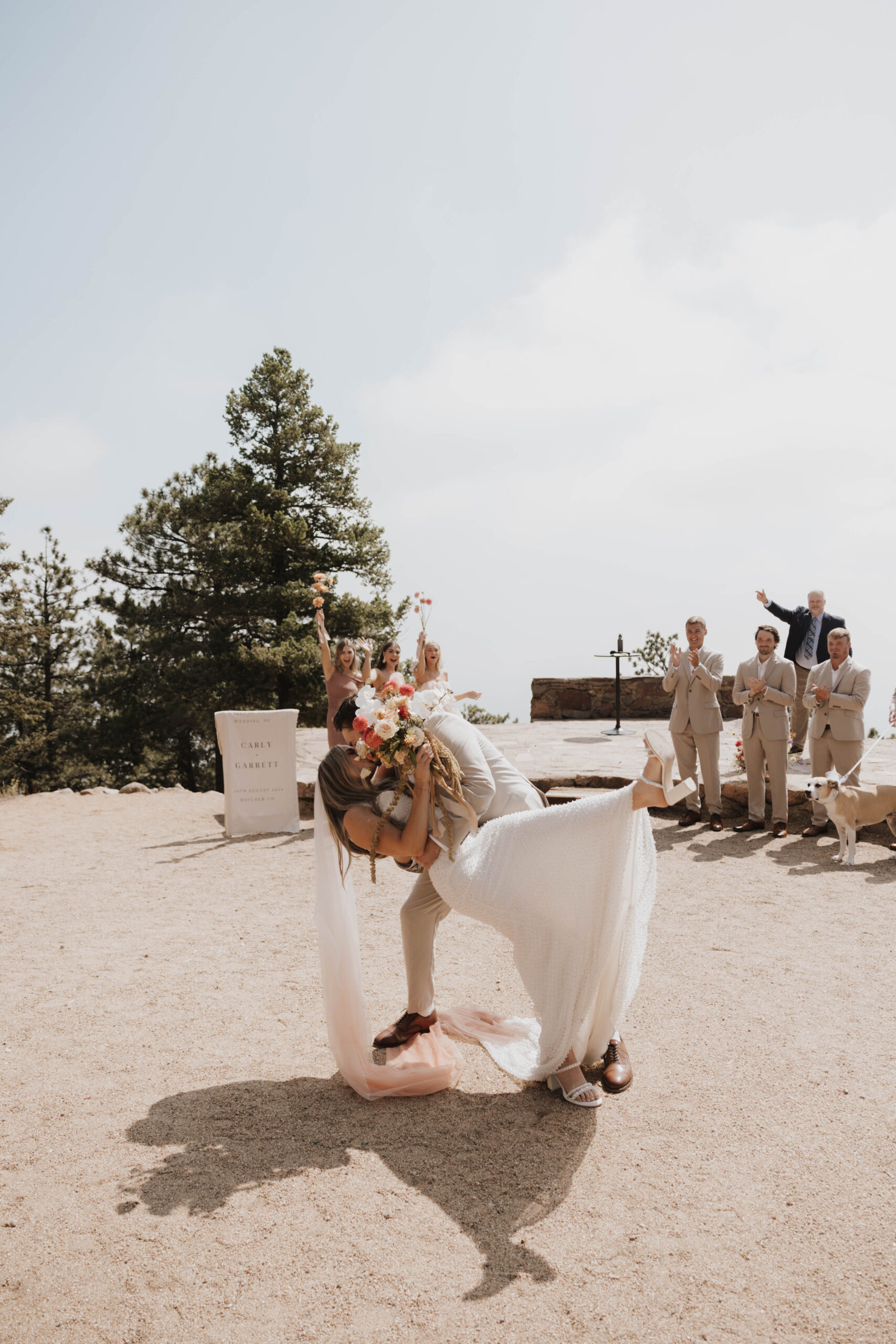 bride and groom kissing at the altar 