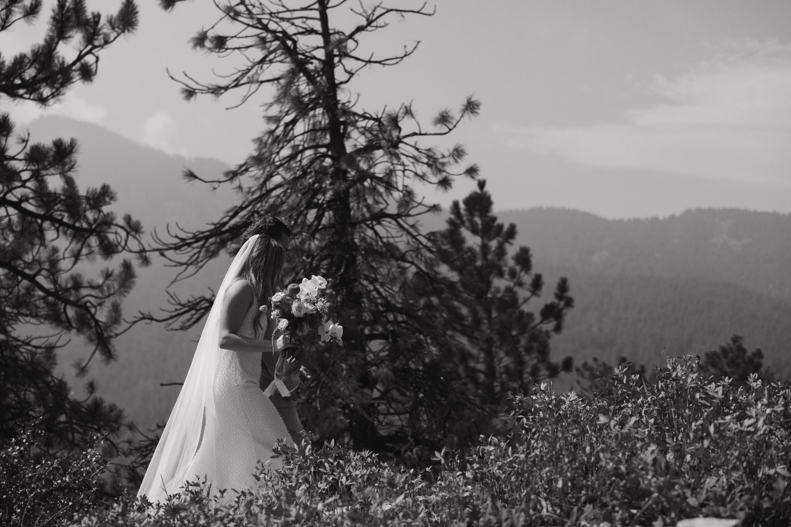 bride and groom walking away from Boulder Colorado wedding ceremony 