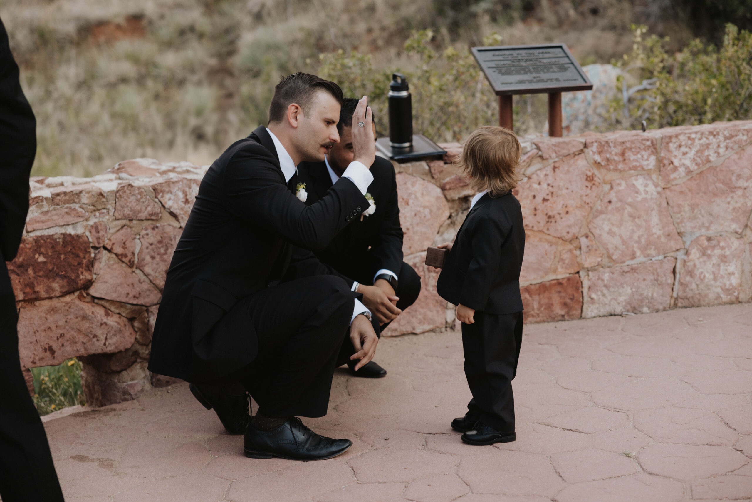 a man giving a high five to a child