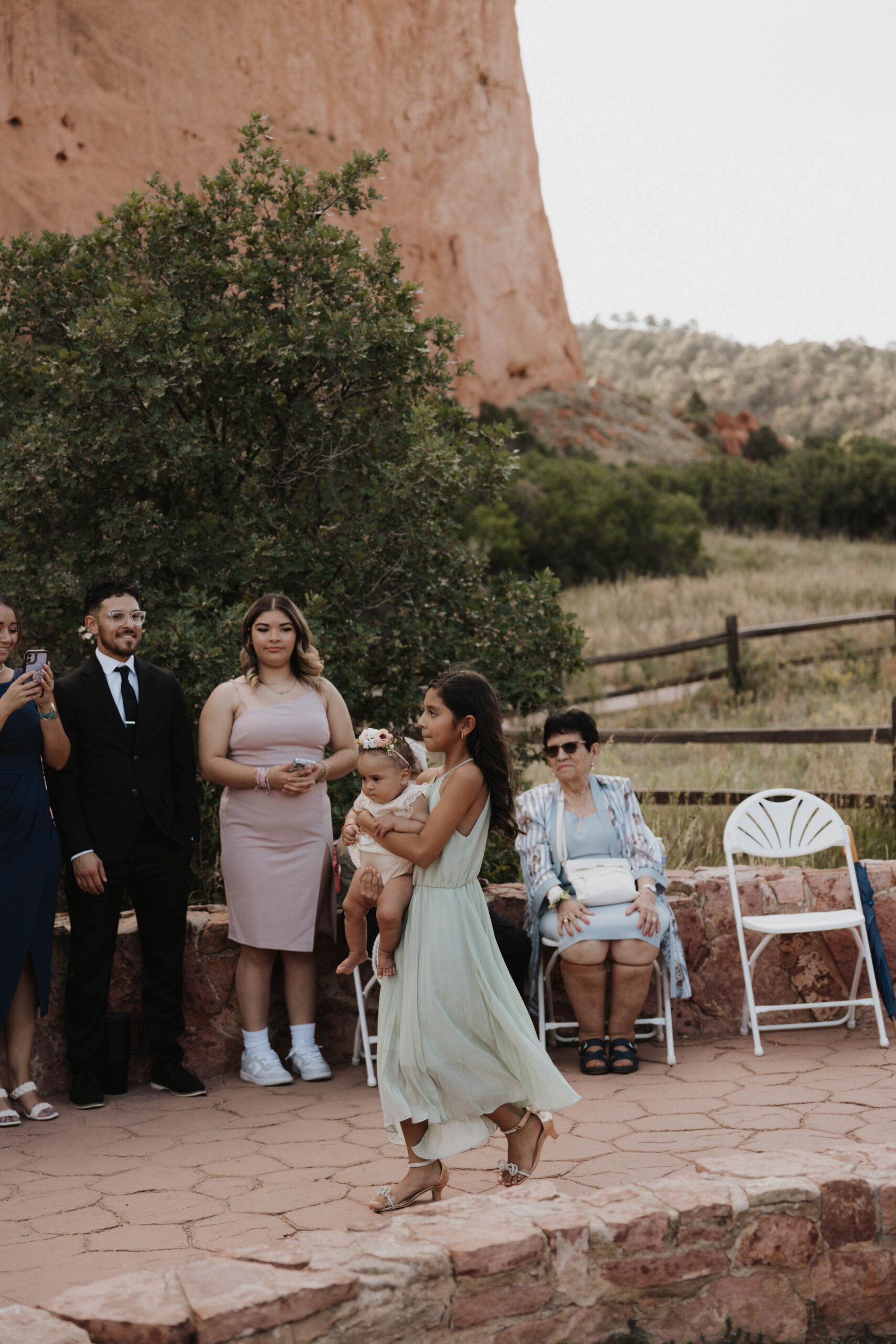 a child walking with a baby down the aisle