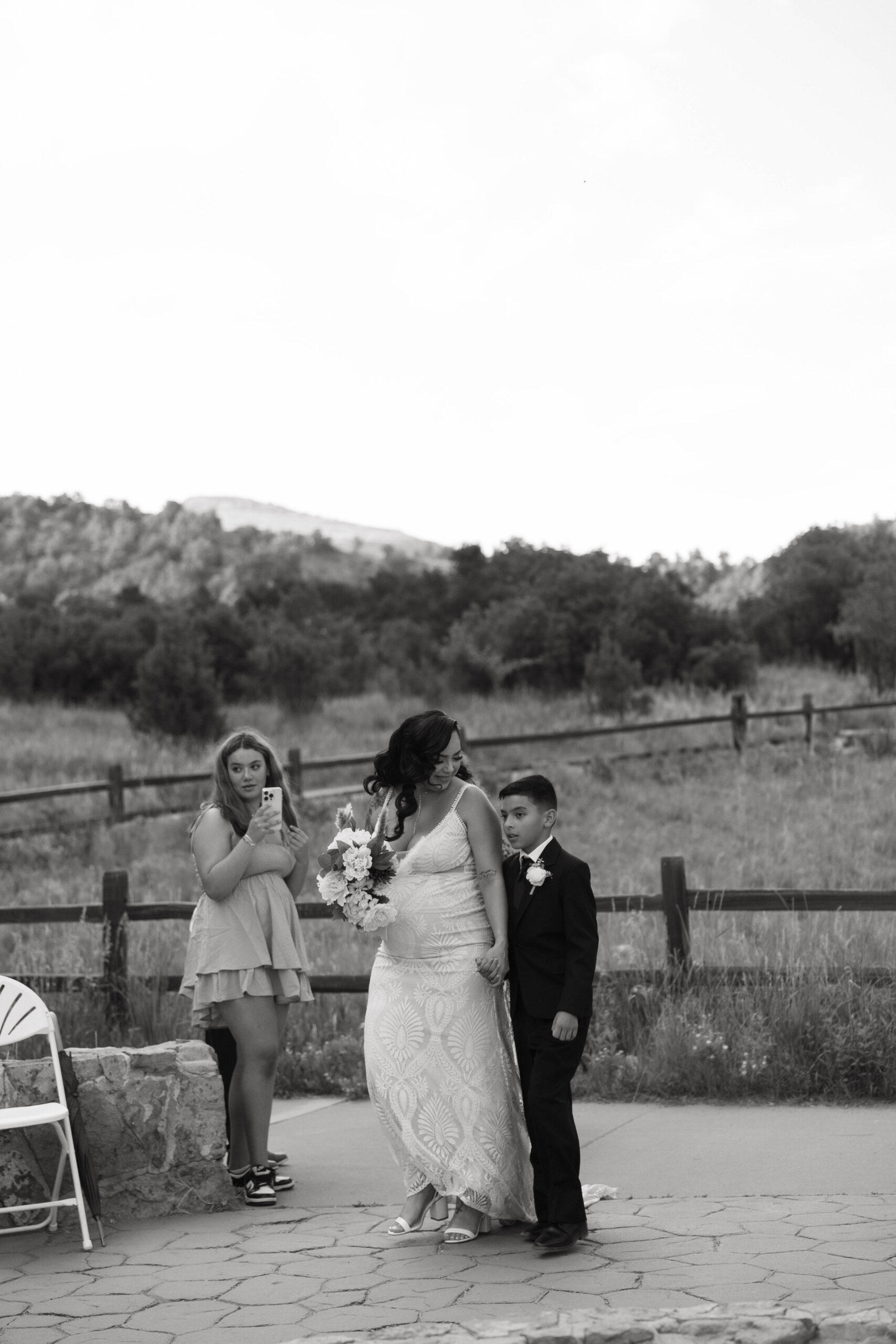 bride and her son walking down the aisle 