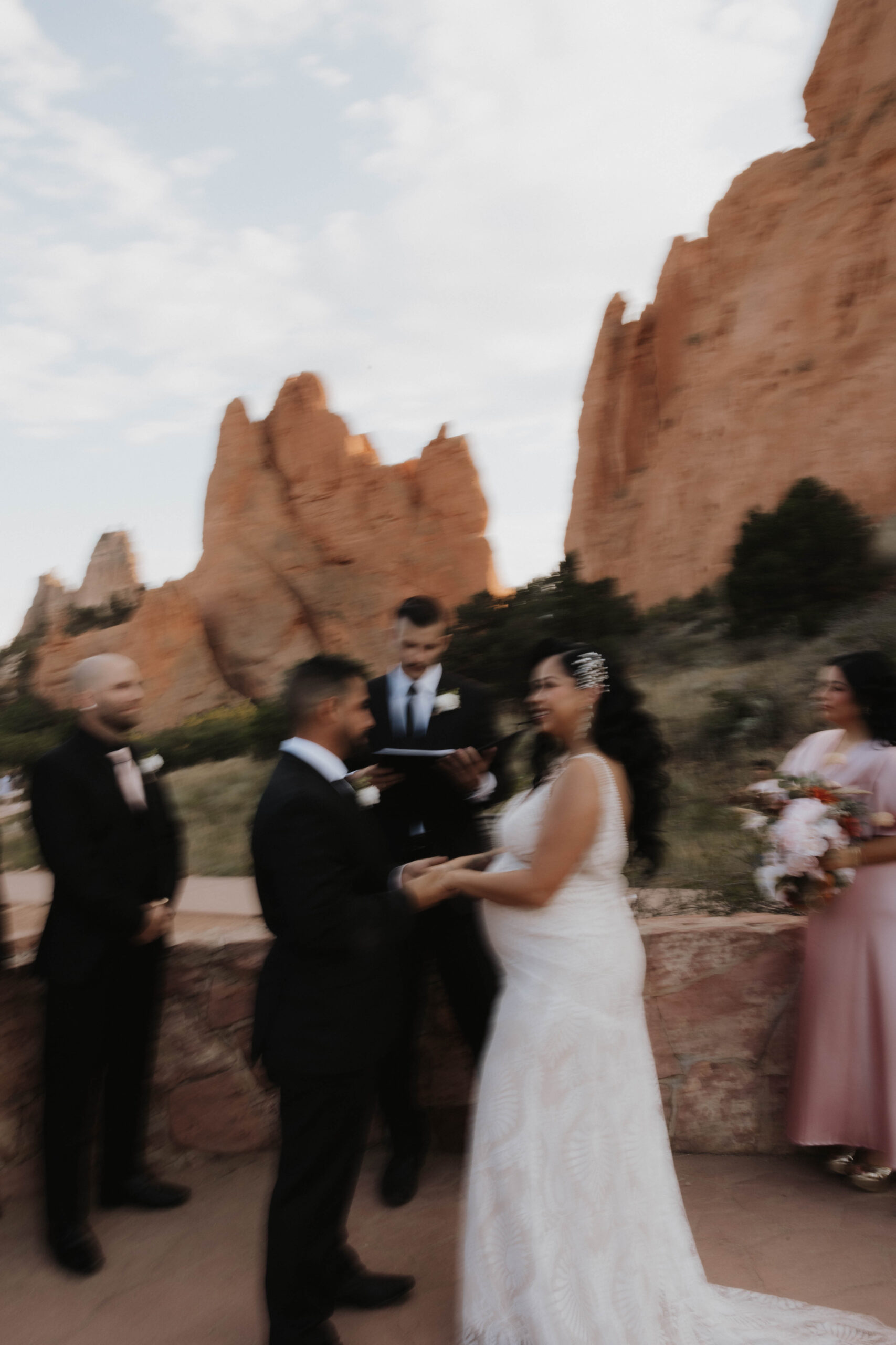 bride and groom during wedding at garden of the gods ceremony 