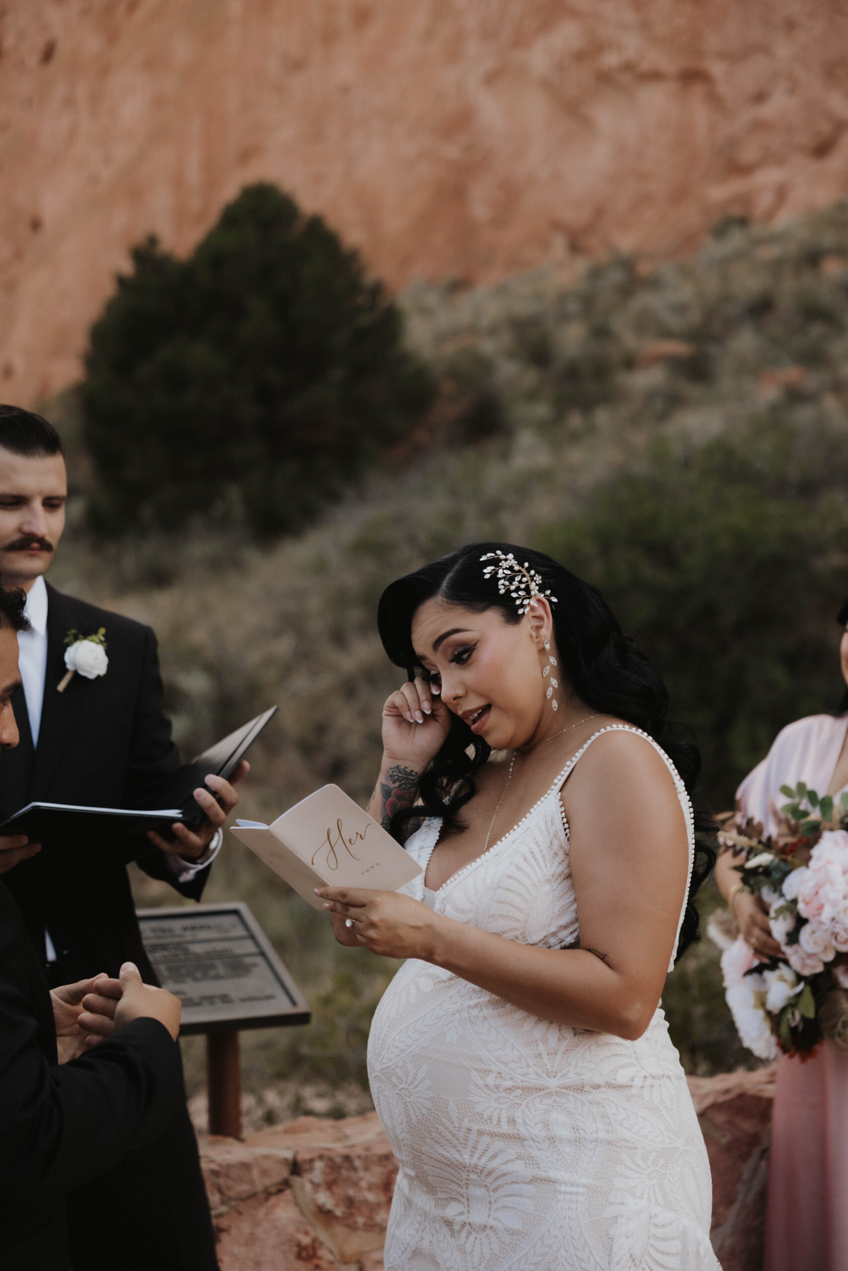 bride tearing up while reading her vows