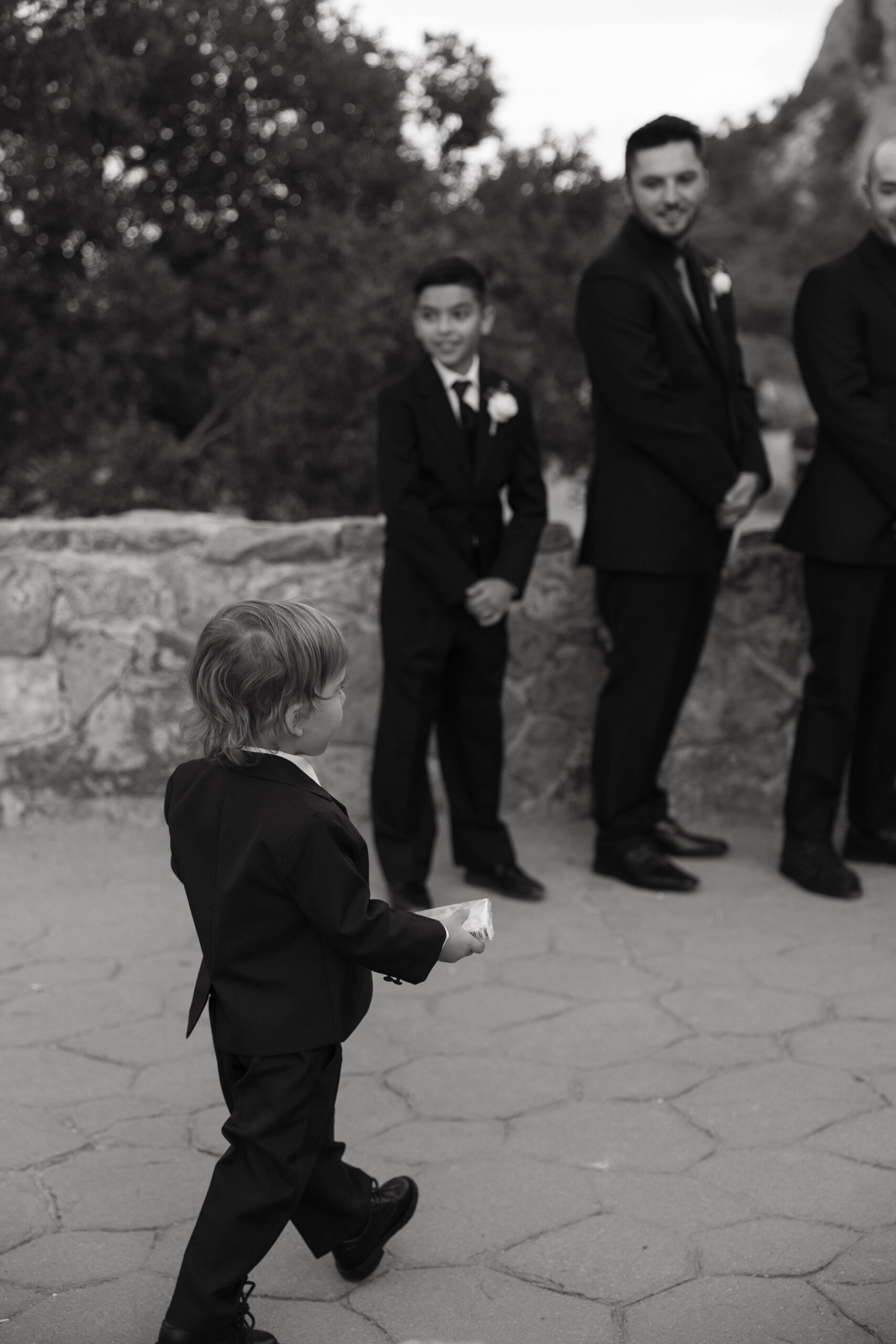 ring bearer walking to the bride and groom 