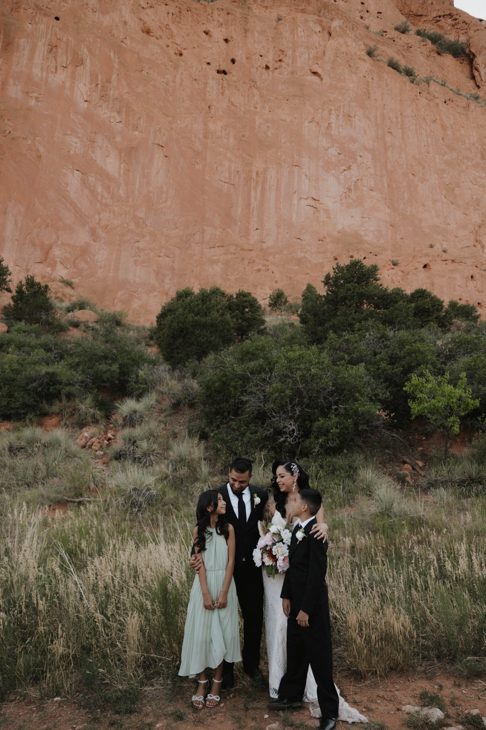 wedding couple and their children during wedding at garden of the gods