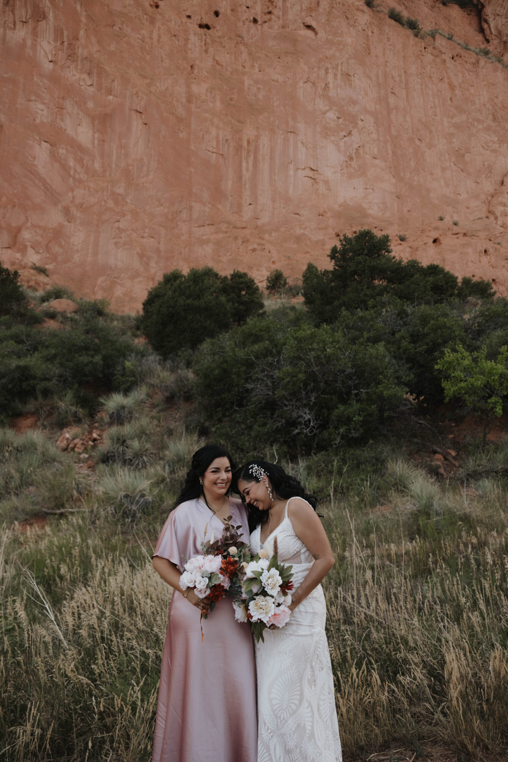 bride and a bridesmaids taking a photo