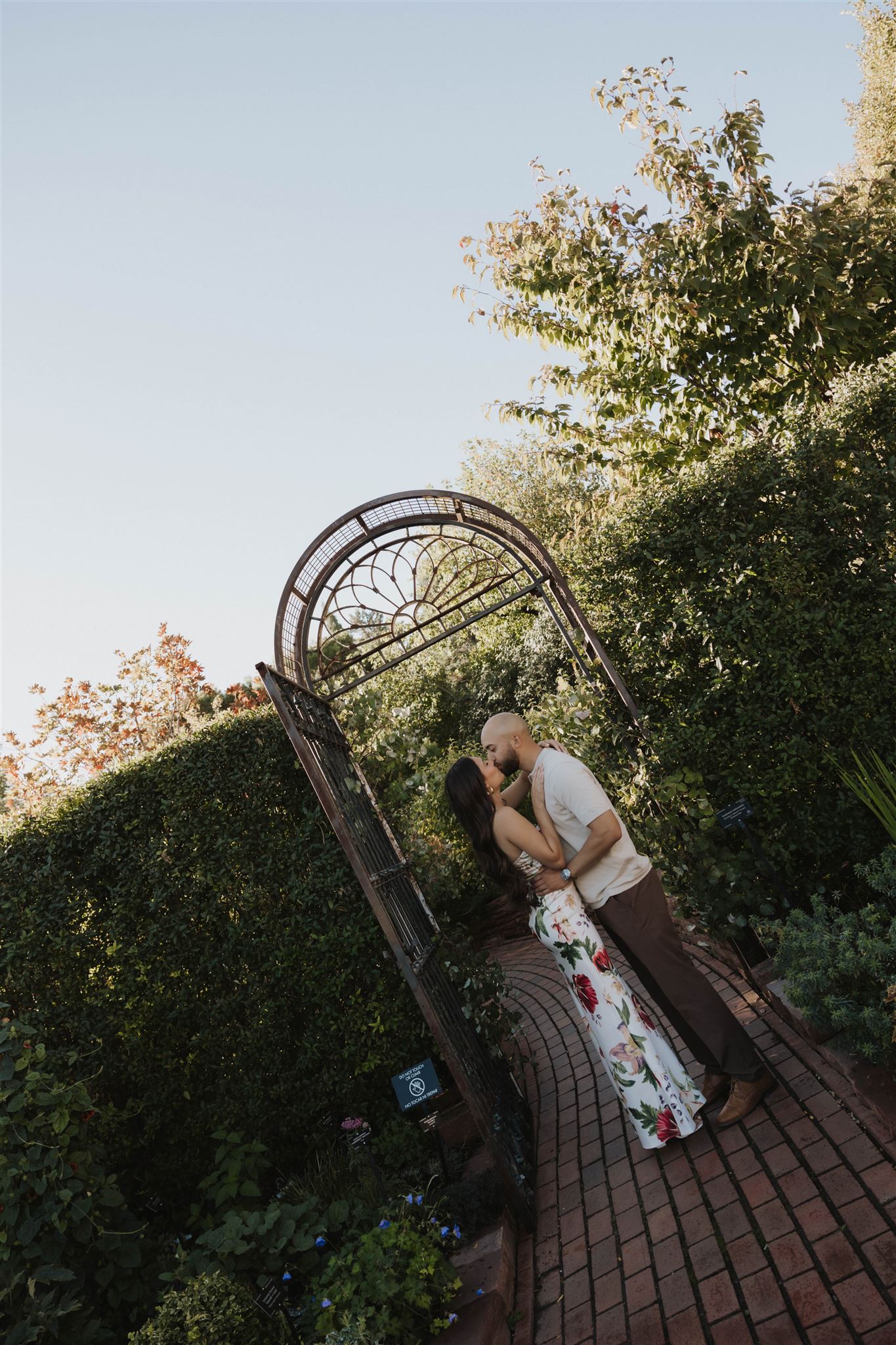 a couple kissing during their Denver Botanic Gardens Engagement Photos session