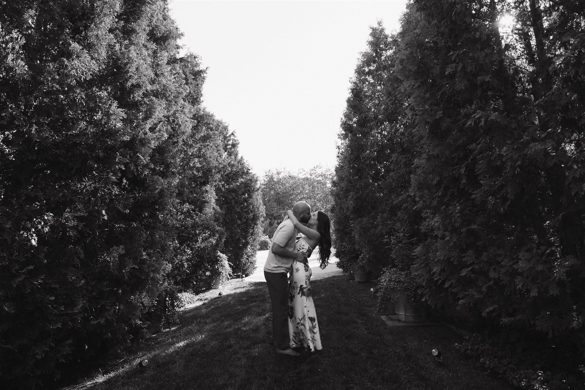 a couple kissing in the garden during their Denver Botanic Gardens Engagement Photos