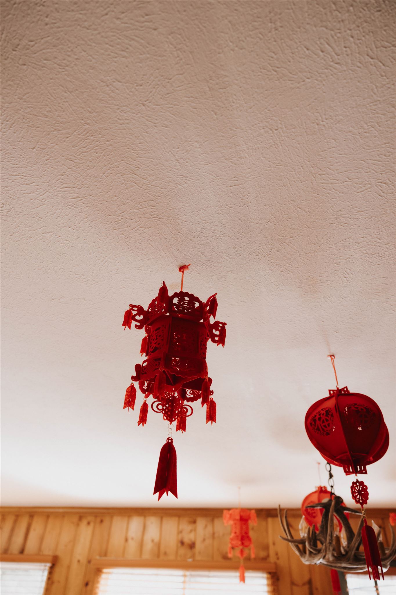 traditional lanterns hanging from the ceiling 