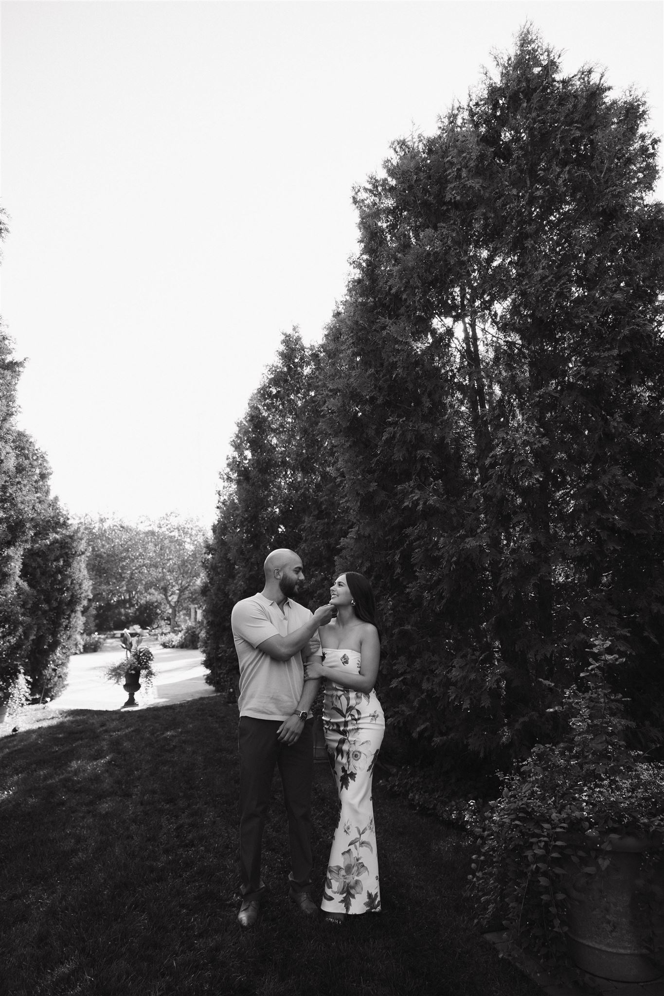 newly engaged couple in a romantic garden for their engagement photos