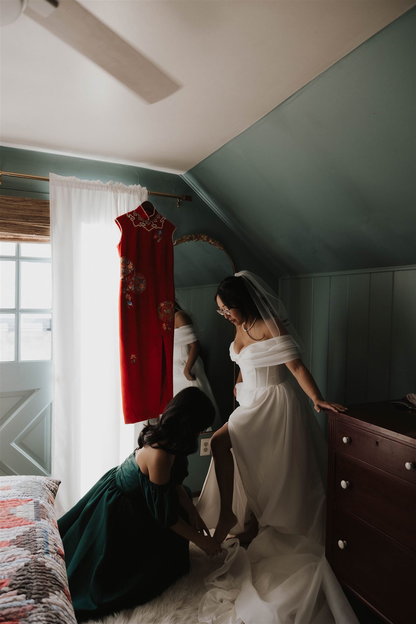 bride's sister helping her put on her shoes for the Sapphire Point Elopement