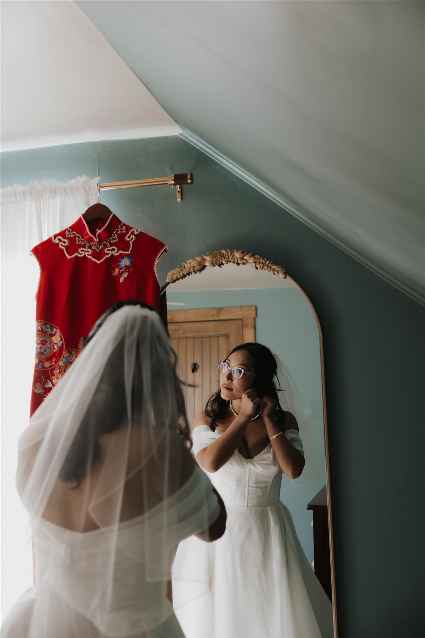 bride looking into the mirror, getting ready for her Sapphire Point Elopement