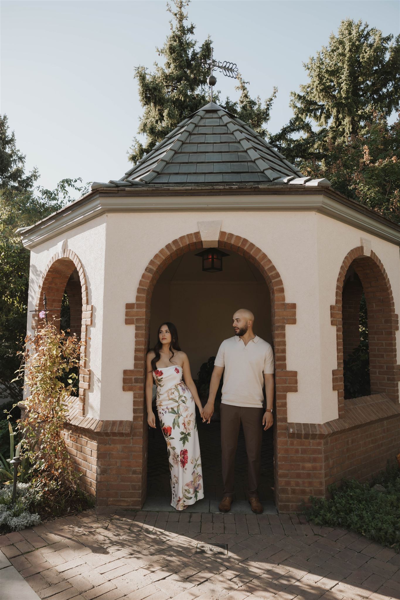 newly engaged couple at their engagement session next to an Italian inspired villa 