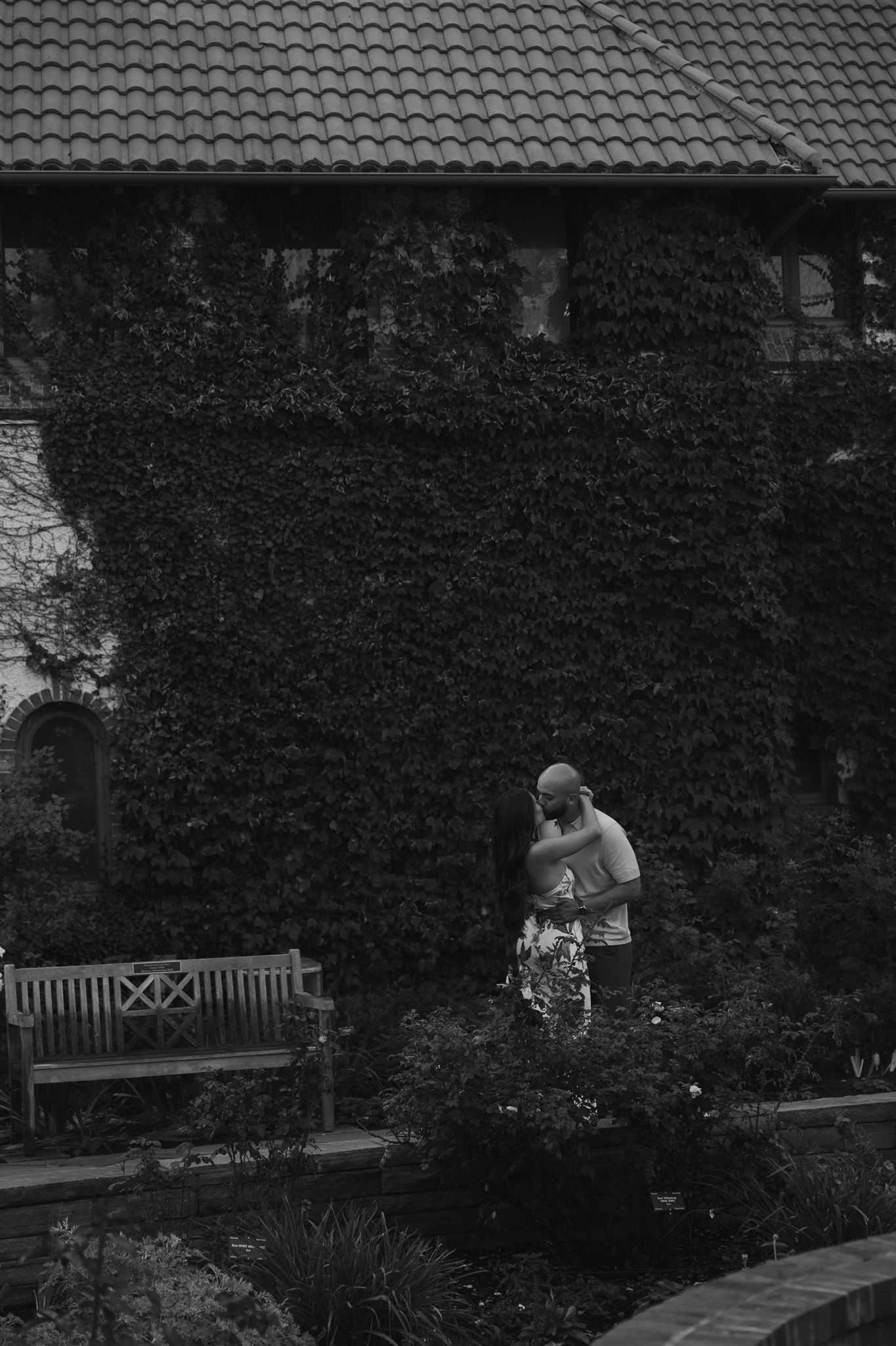 a couple kissing in the gardens during their Denver Botanic Gardens Engagement Photos