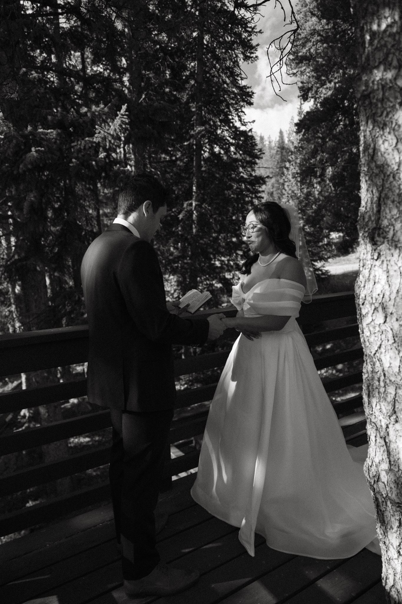 bride and groom reading their vows privately 