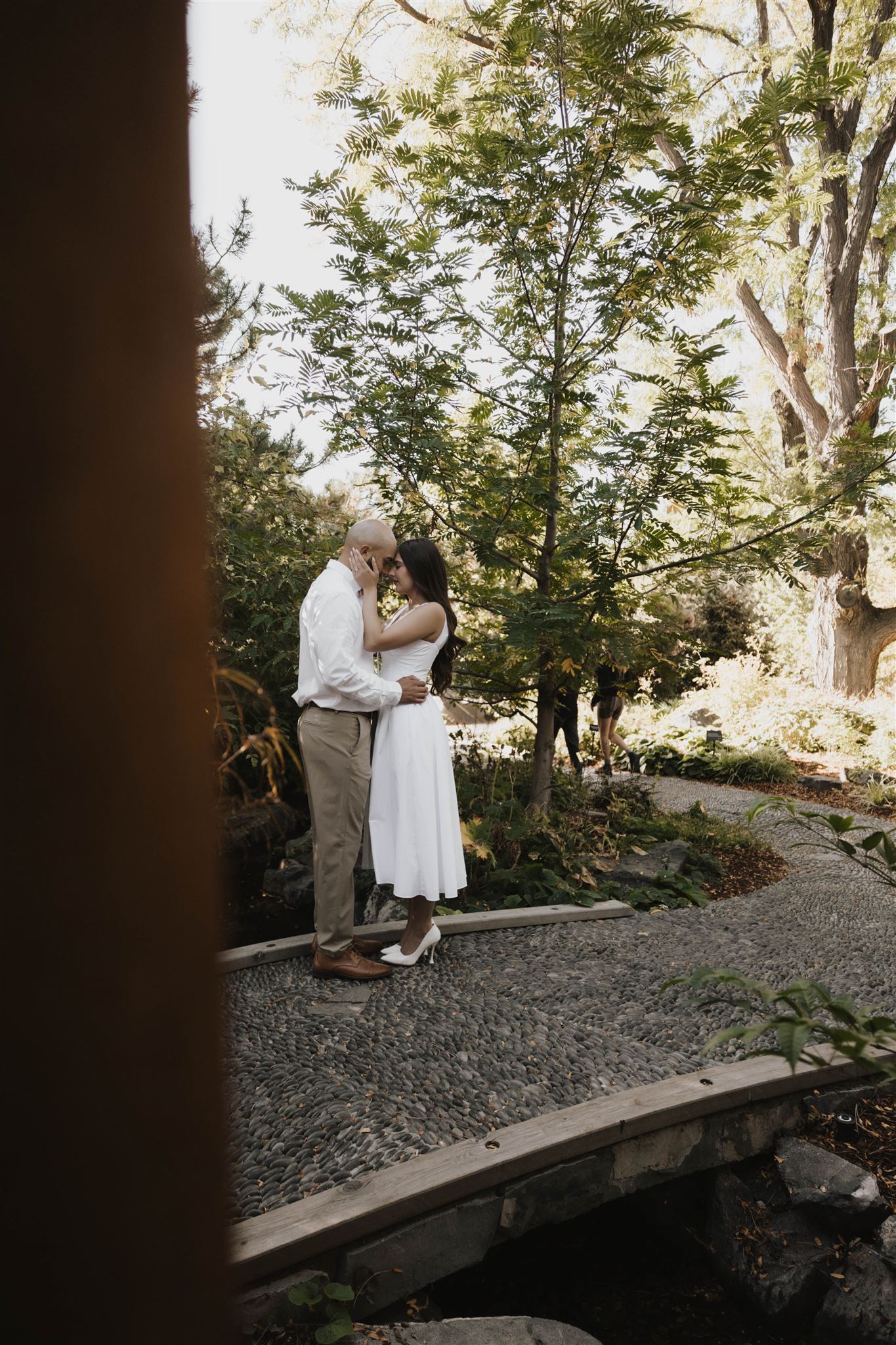 a couple standing with their foreheads together during their engagement session 